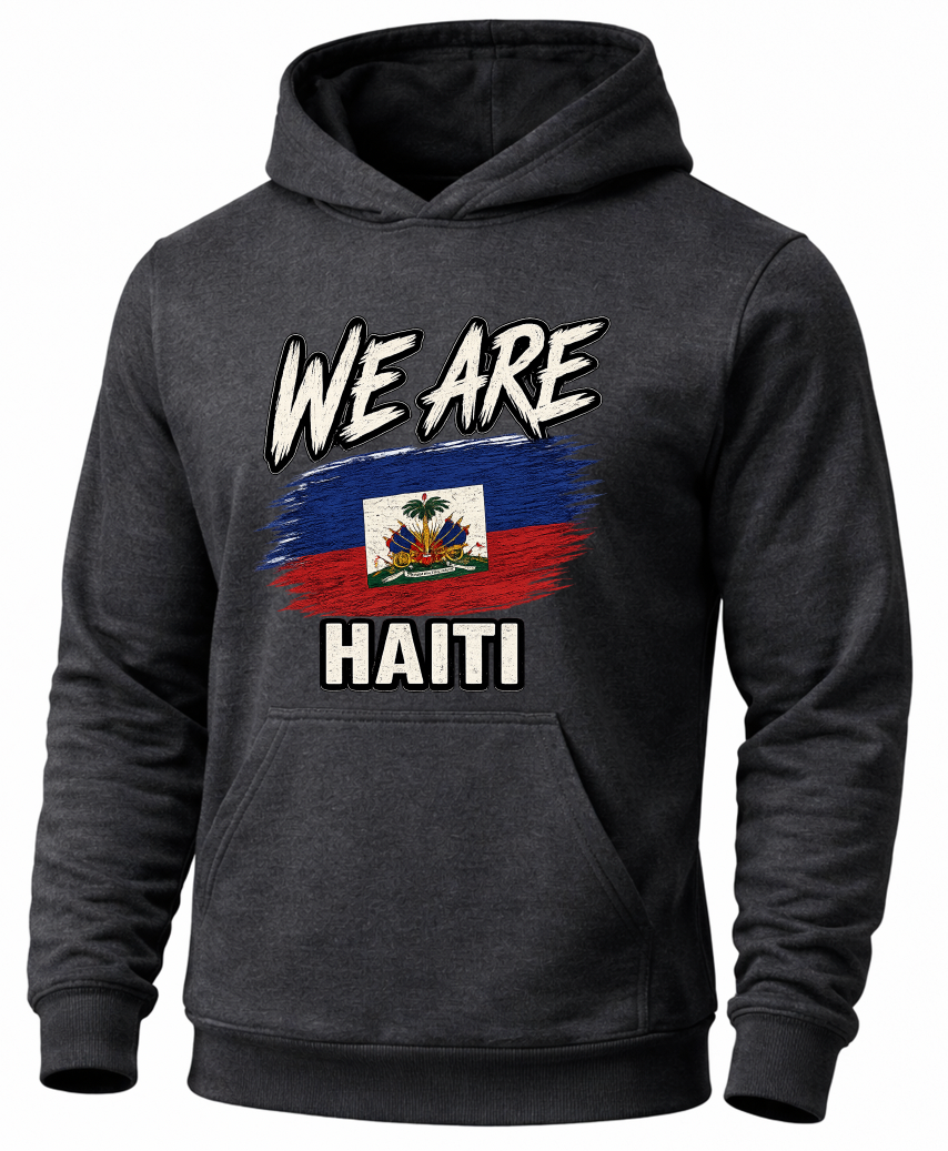 A dark gray heather pullover hoodie with a graphic on the chest that reads 'WE ARE HAITI' above and below a stylized Haitian flag, shown on a plain white background.