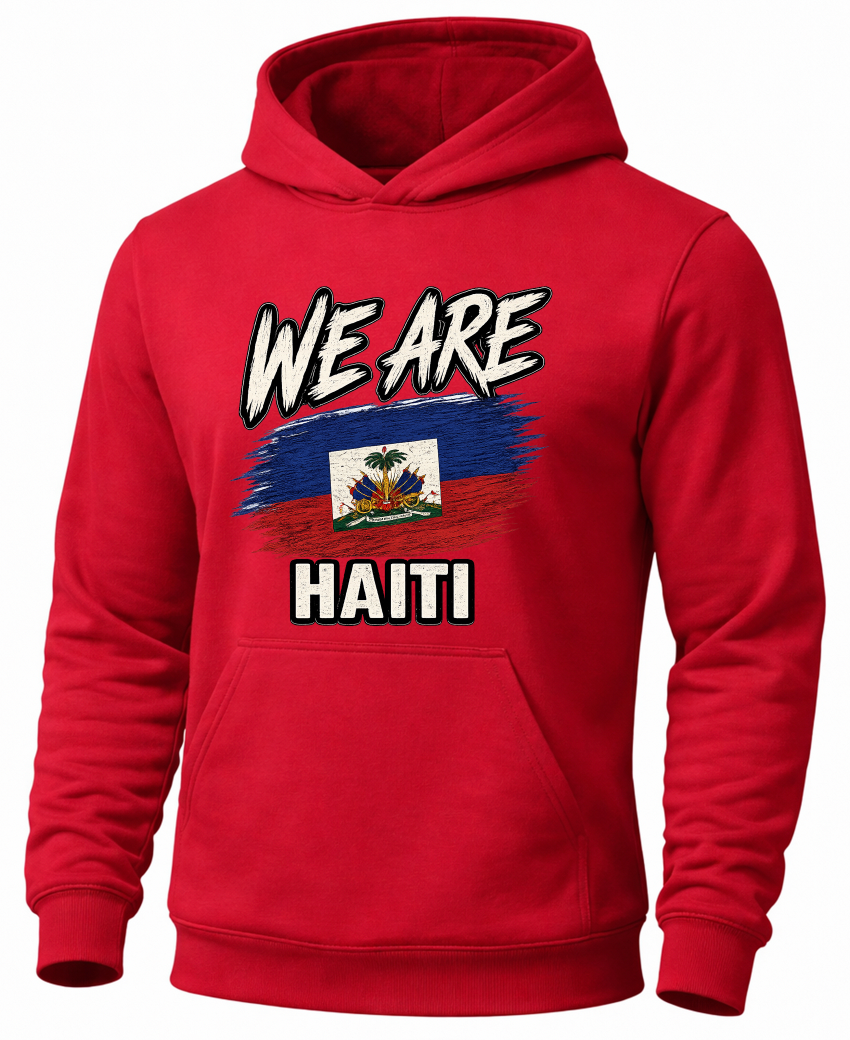 A red pullover hoodie featuring a graphic print on the front with the text 'WE ARE HAITI' and a stylized Haitian flag, shown against a plain white background.
