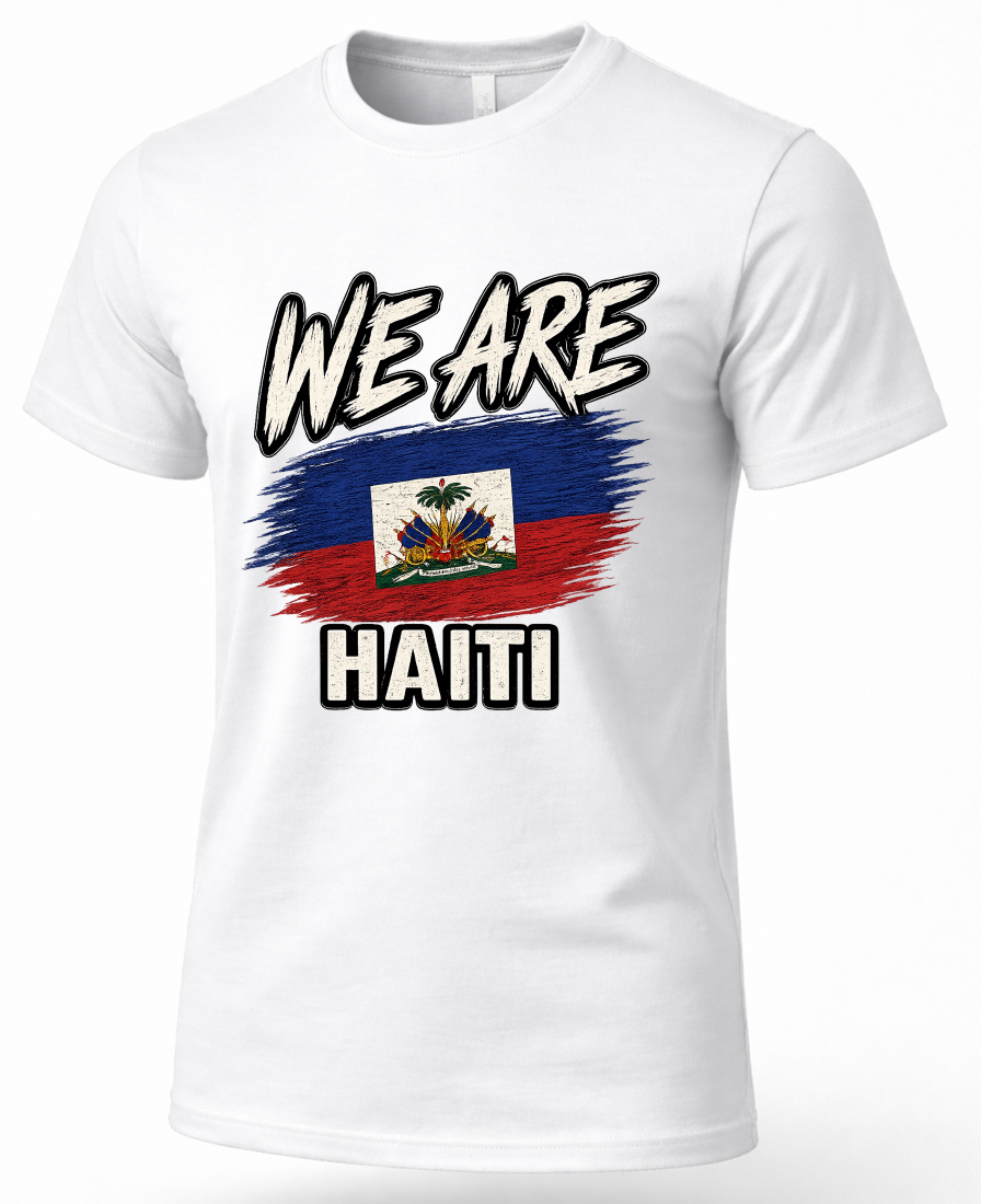 A white short-sleeve crewneck t-shirt featuring a graphic print of the Haitian flag with a brushstroke effect and the words 'WE ARE' above and 'HAITI' below in bold black-and-white lettering.