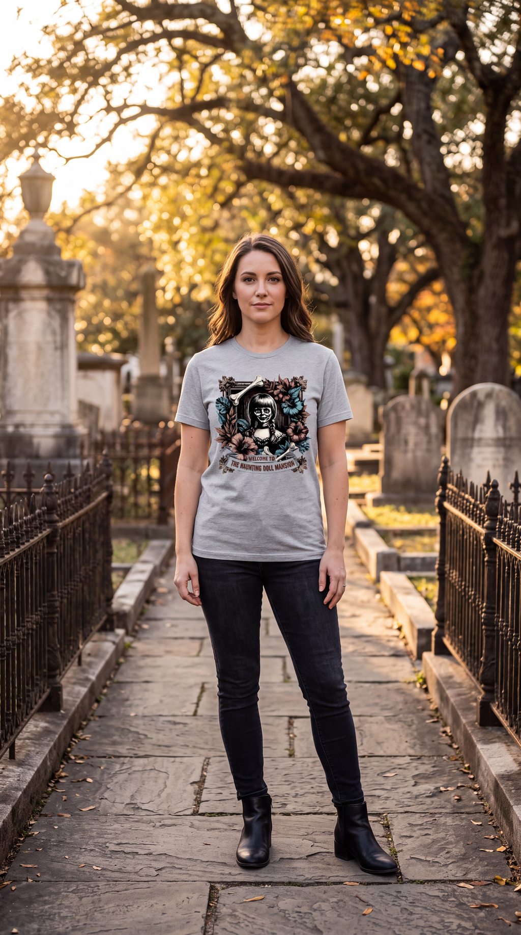 Female model wearing heather gray creepy doll Halloween graphic T-shirt outdoors