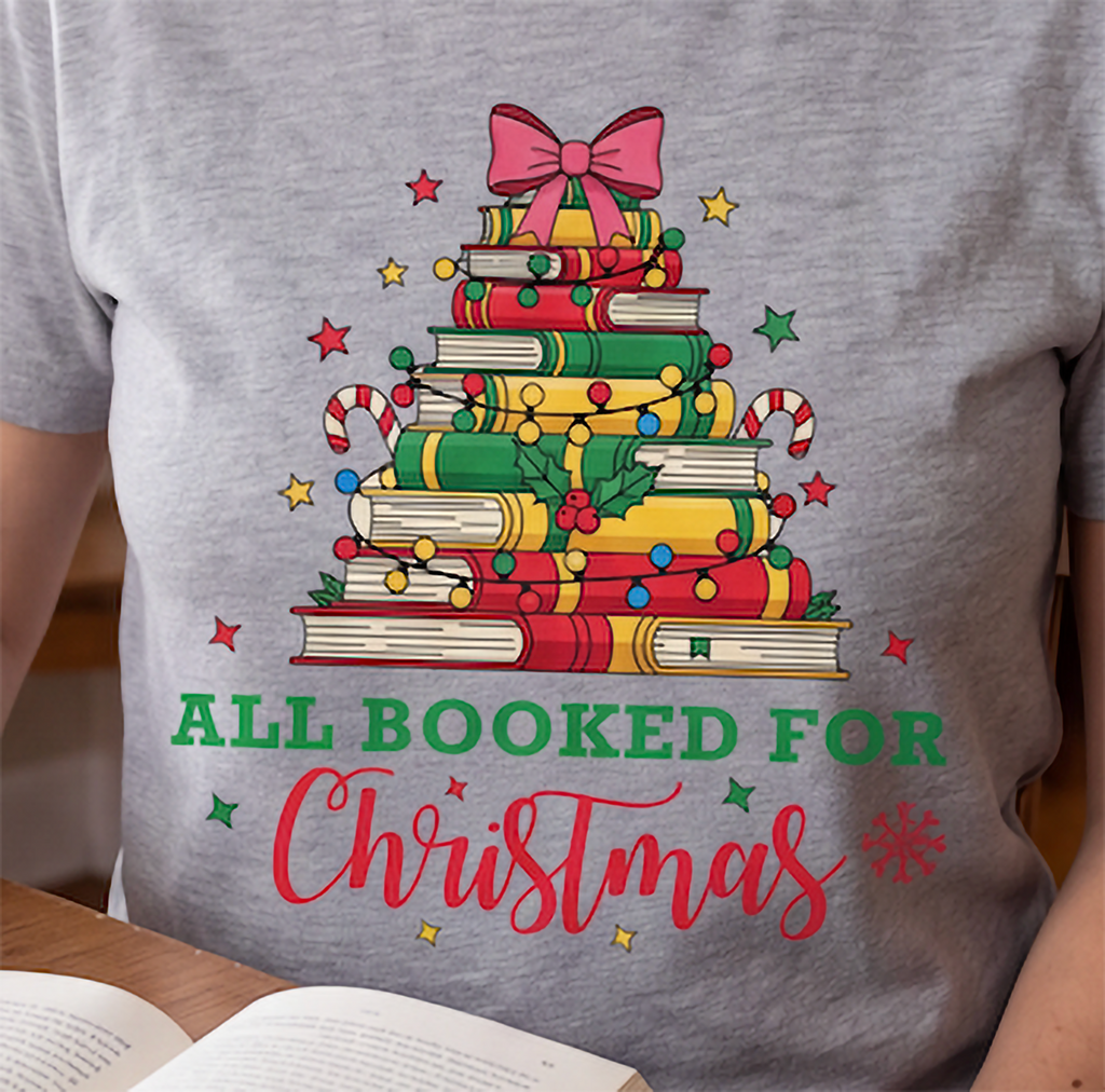 Close-up of heather gray All Booked for Christmas shirt featuring the festive book lover Christmas design.