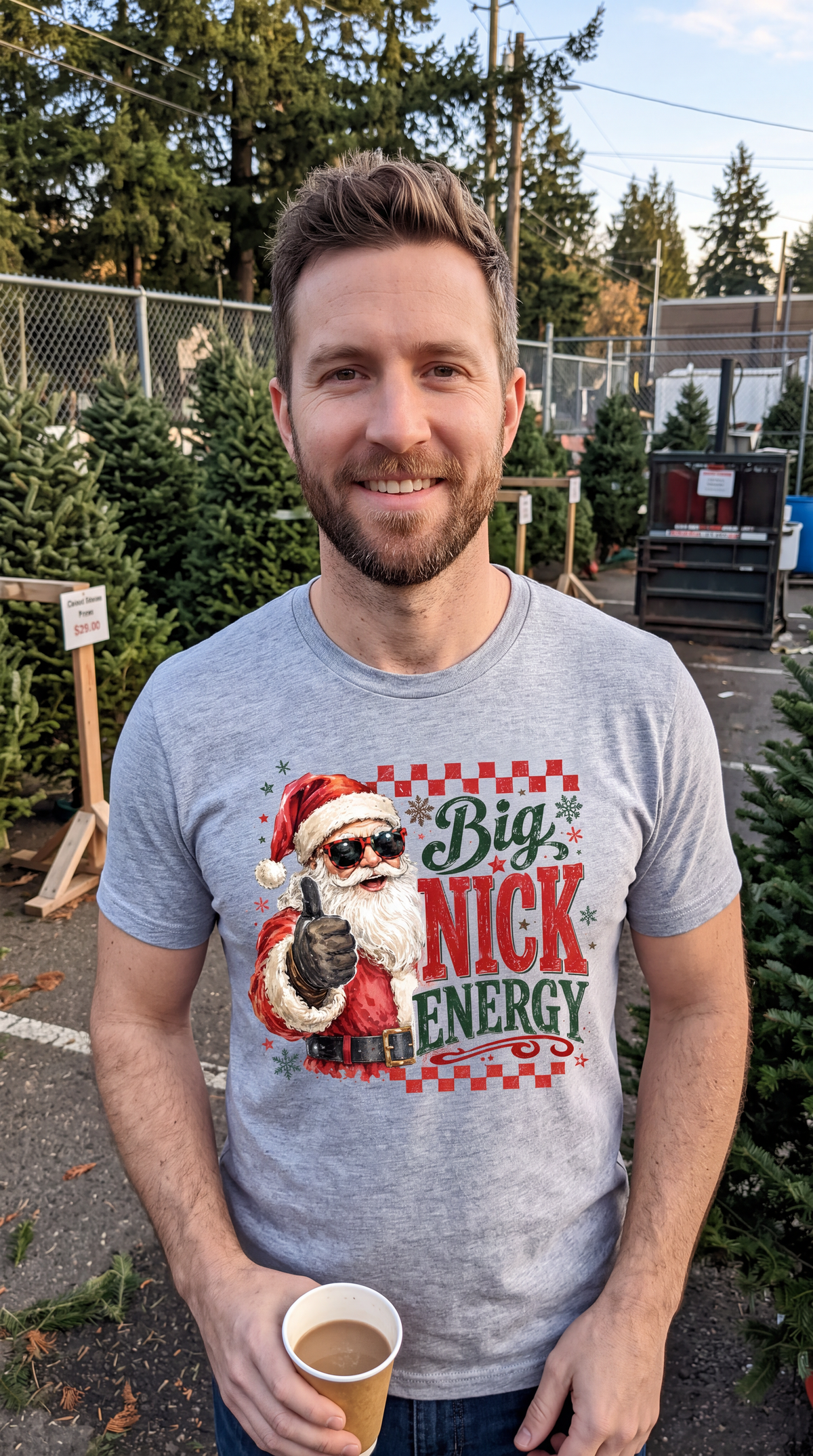 Model wearing heather gray Big Nick Energy funny Santa Christmas shirt