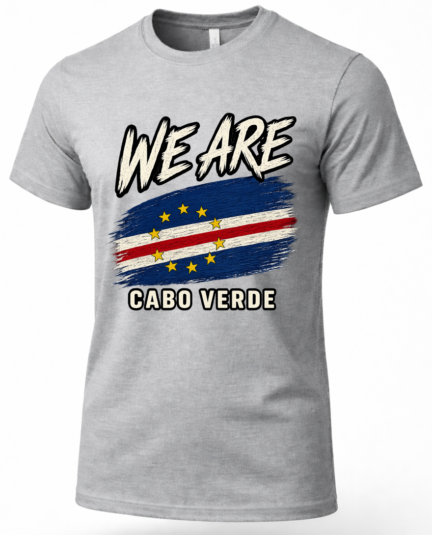 A heather gray short-sleeve t-shirt with a graphic print of the Cabo Verde flag and the text 'WE ARE CABO VERDE' in white with black outlines.