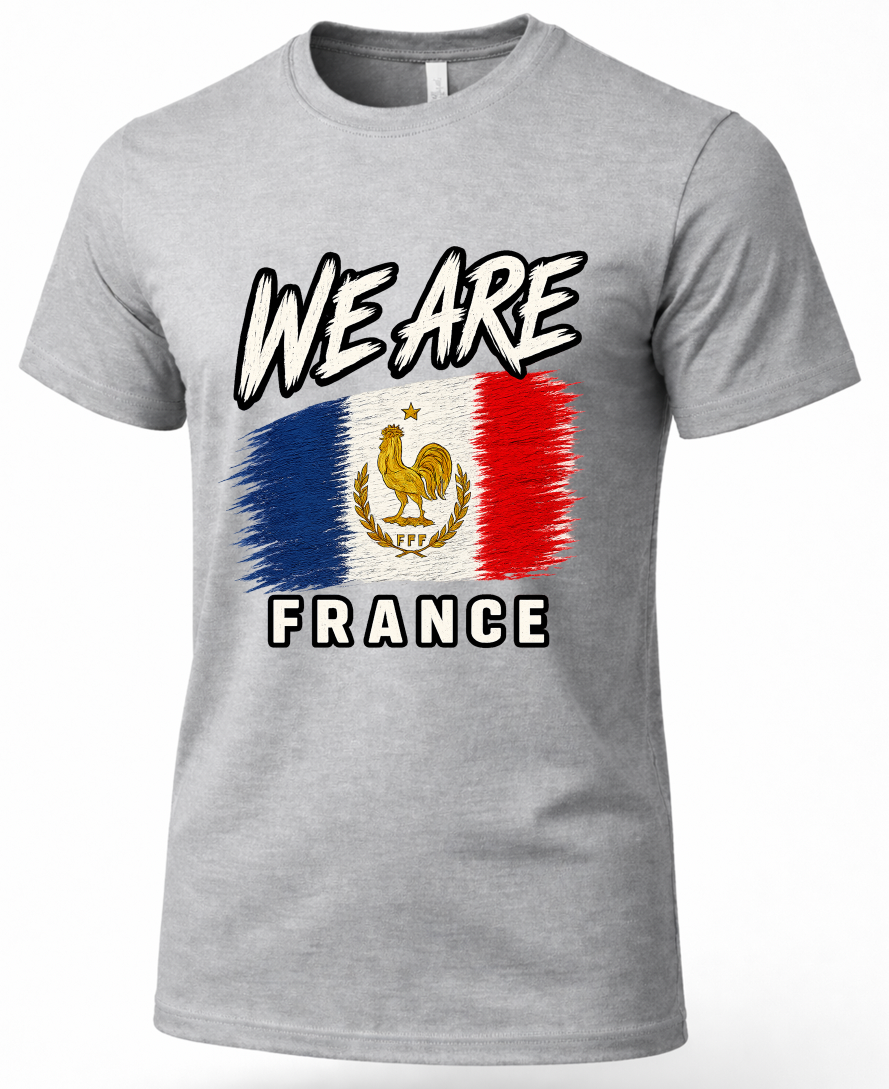 A heather gray short-sleeve crewneck t-shirt featuring a graphic print of the French flag with a golden rooster emblem, accompanied by the text 'WE ARE' above and 'FRANCE' below.