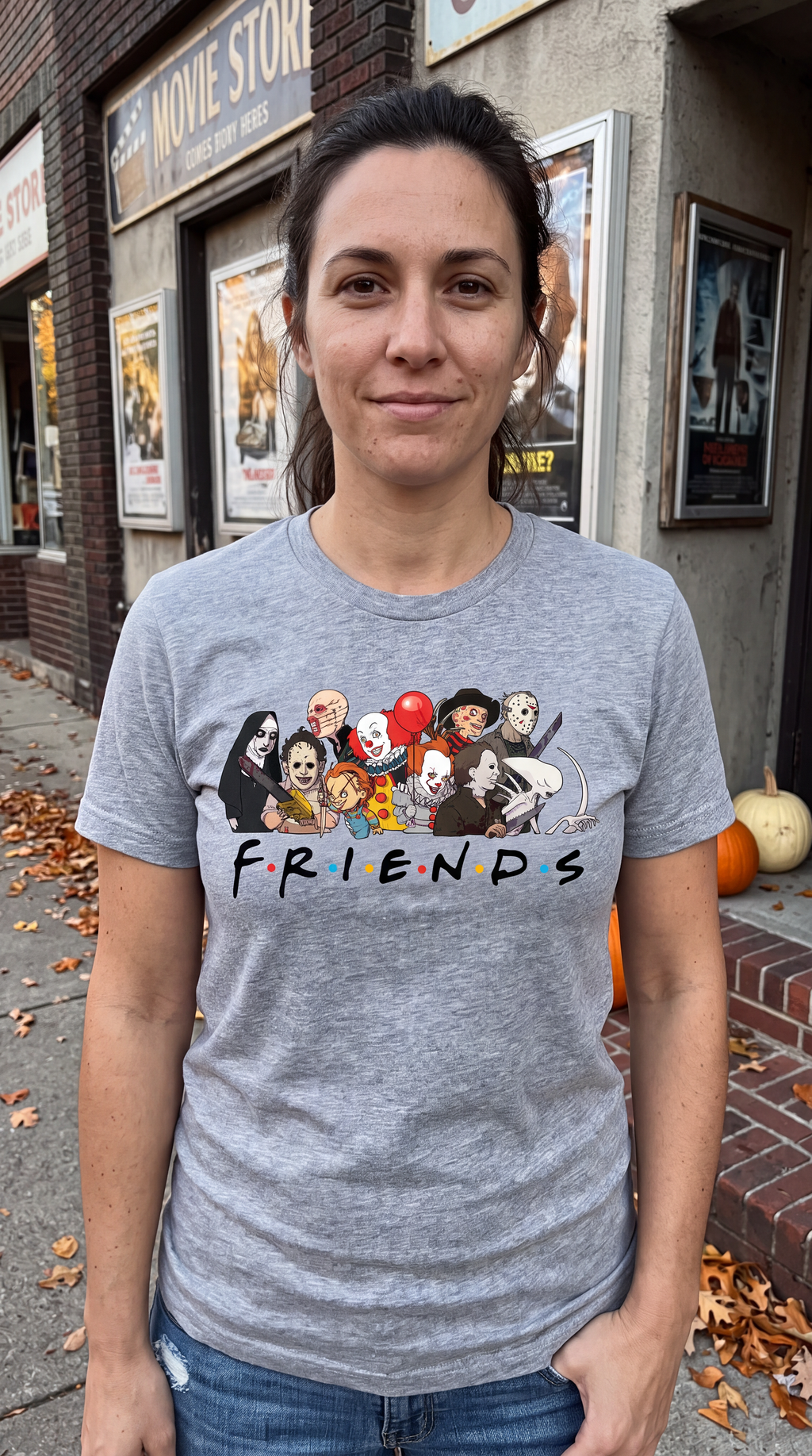 Woman wearing heather gray Horror Friends classic horror Halloween shirt