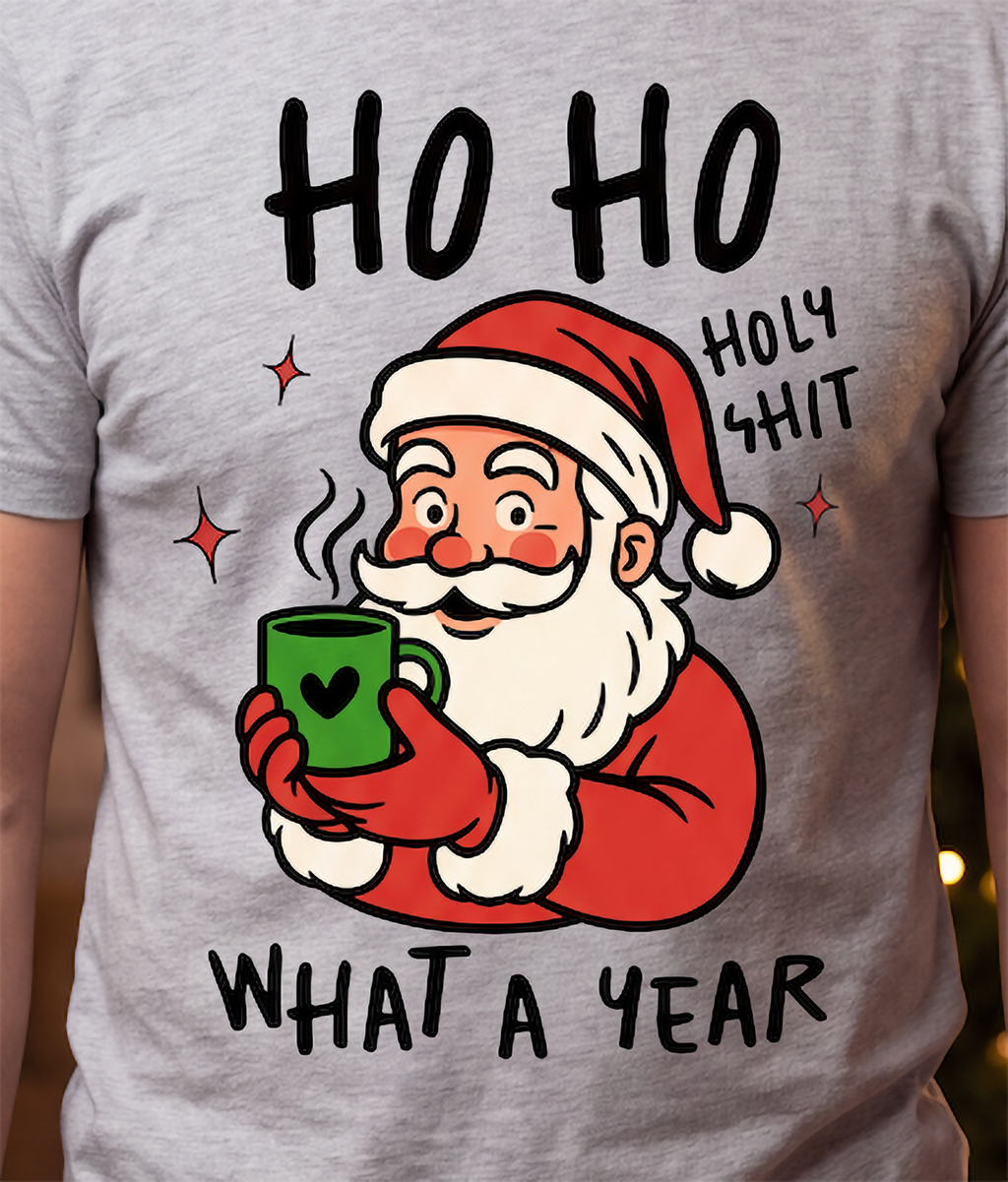 Close-up of Ho Ho Holy Shit What a Year Santa Christmas design printed on gray graphic tee.