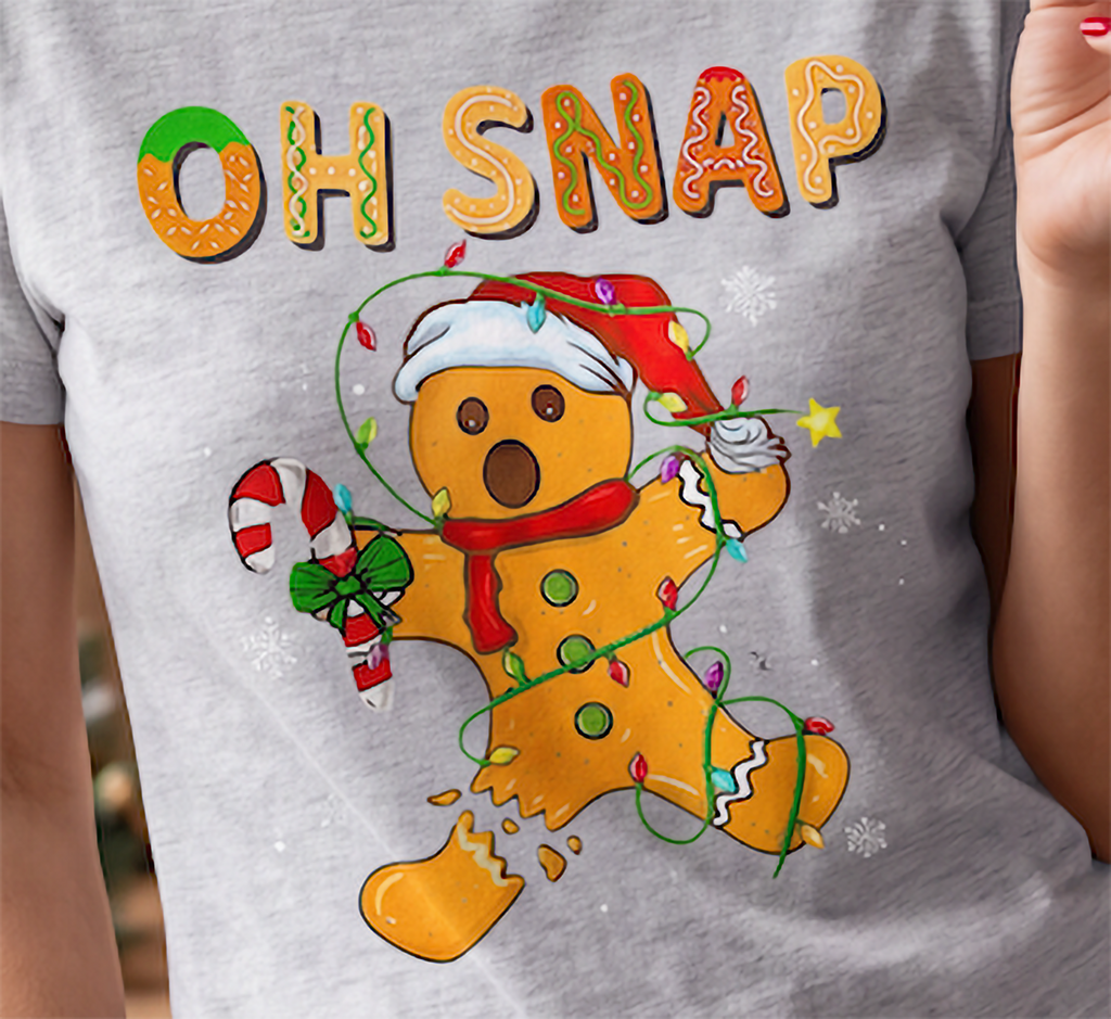 Close-up of Oh Snap gingerbread Christmas design on heather gray shirt