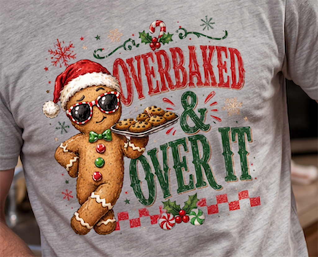 Close-up of funny gingerbread Christmas graphic printed on heather gray shirt.