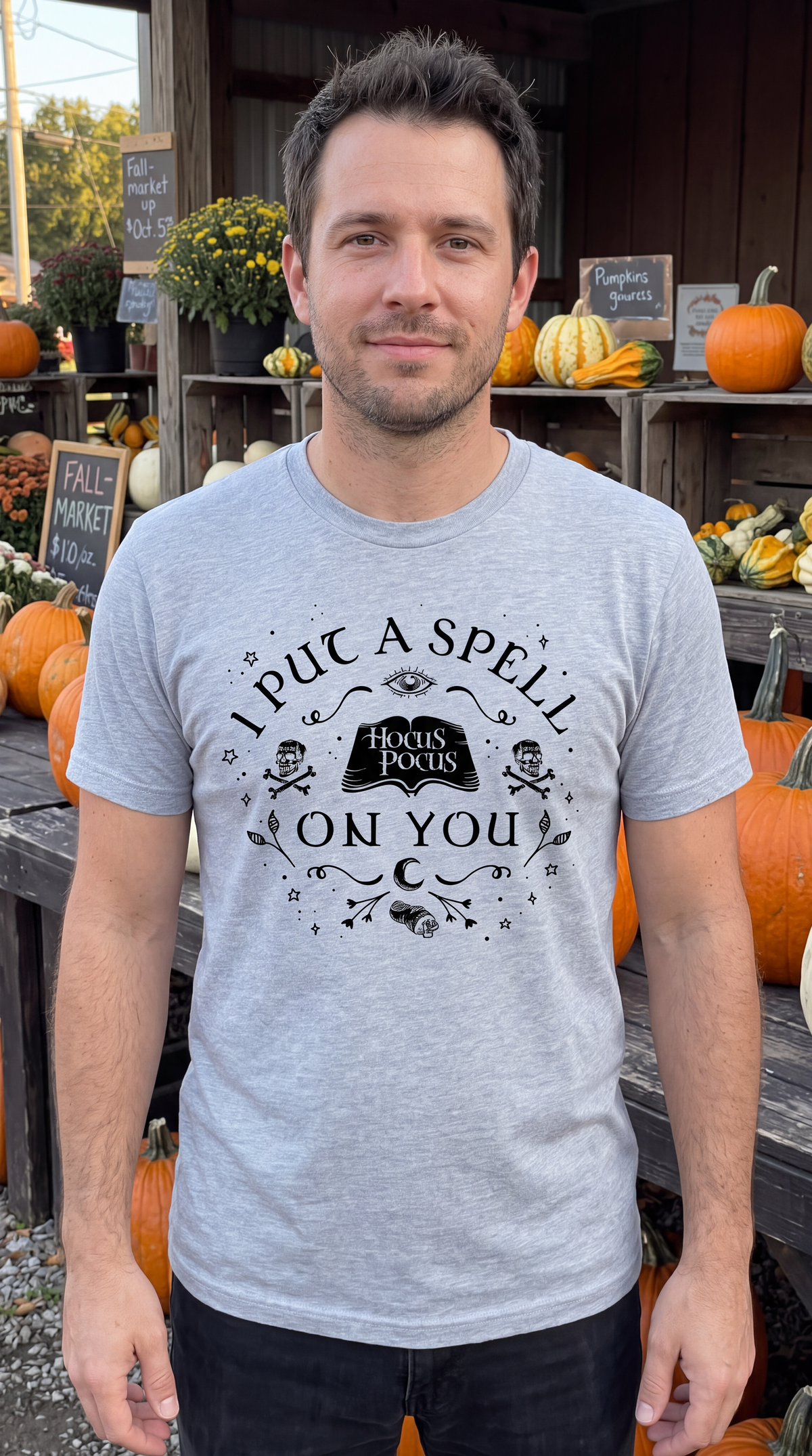Man wearing heather gray Hocus Pocus witchy Halloween graphic tee