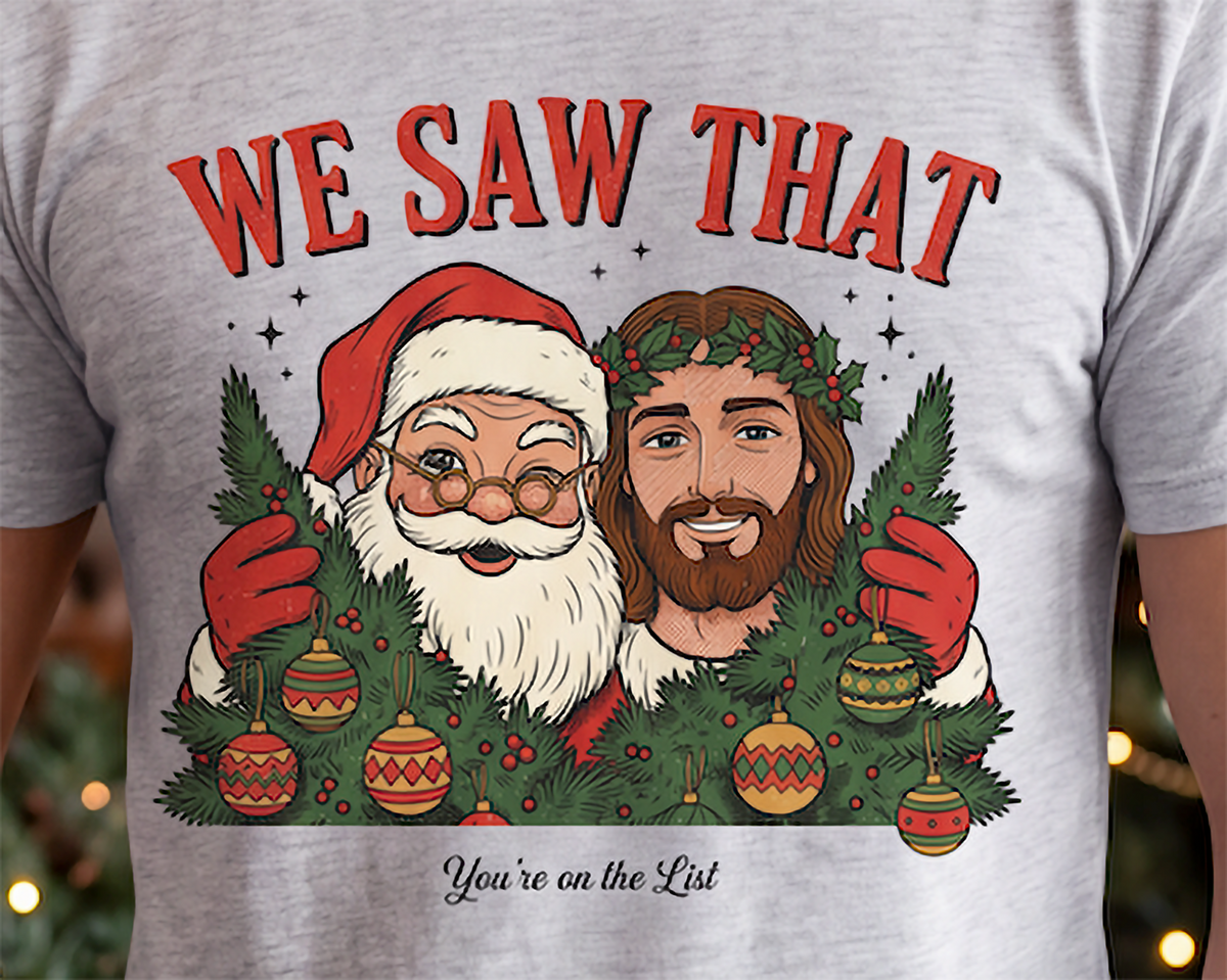 Close-up of We Saw That Santa and Jesus graphic on heather gray Christmas shirt