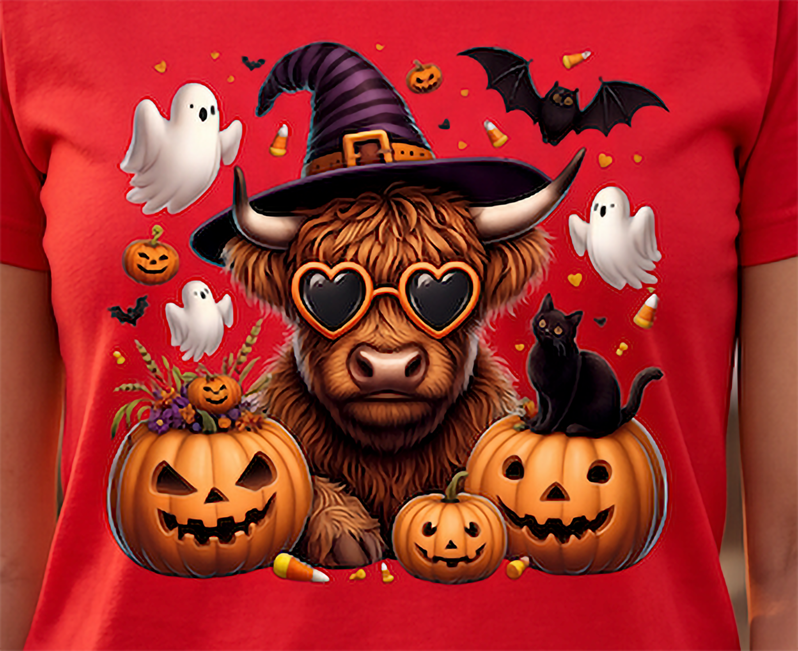 Close-up of Highland cow Halloween design with witch hat, heart sunglasses, pumpkins, ghosts and black cat