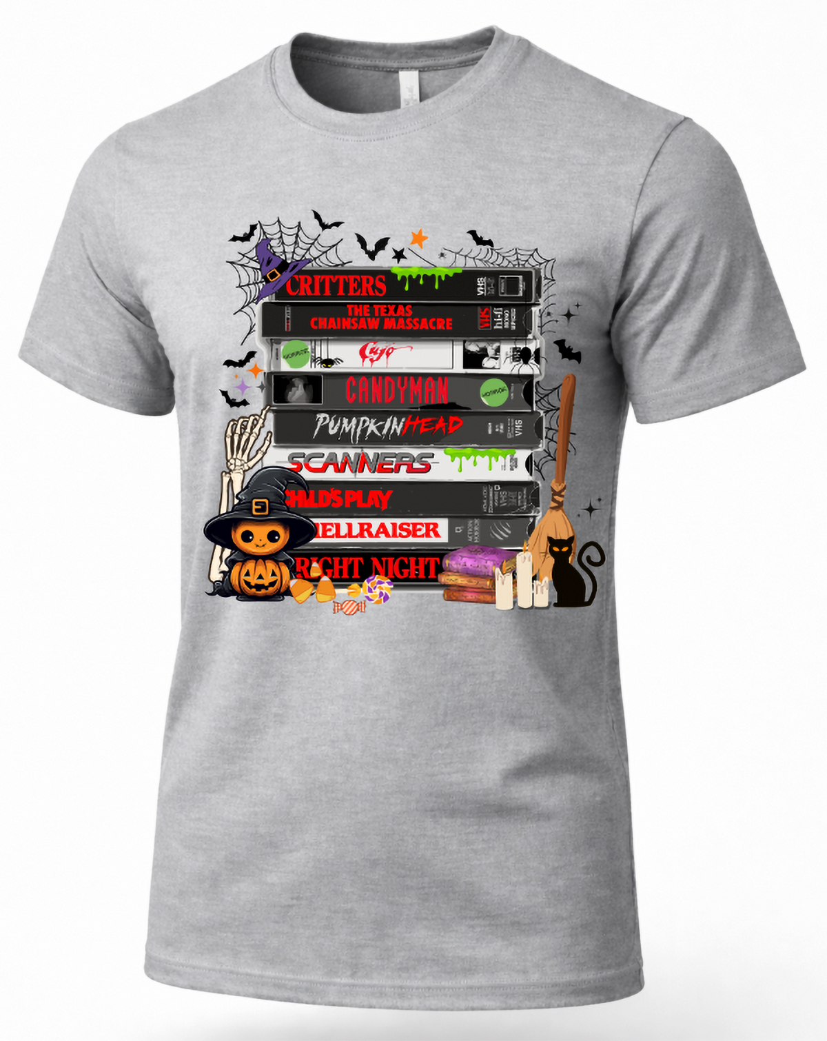 Heather gray retro horror movie VHS T-shirt with stacked scary movie tapes, bats, spiderwebs, pumpkin, candy and black cat graphic.