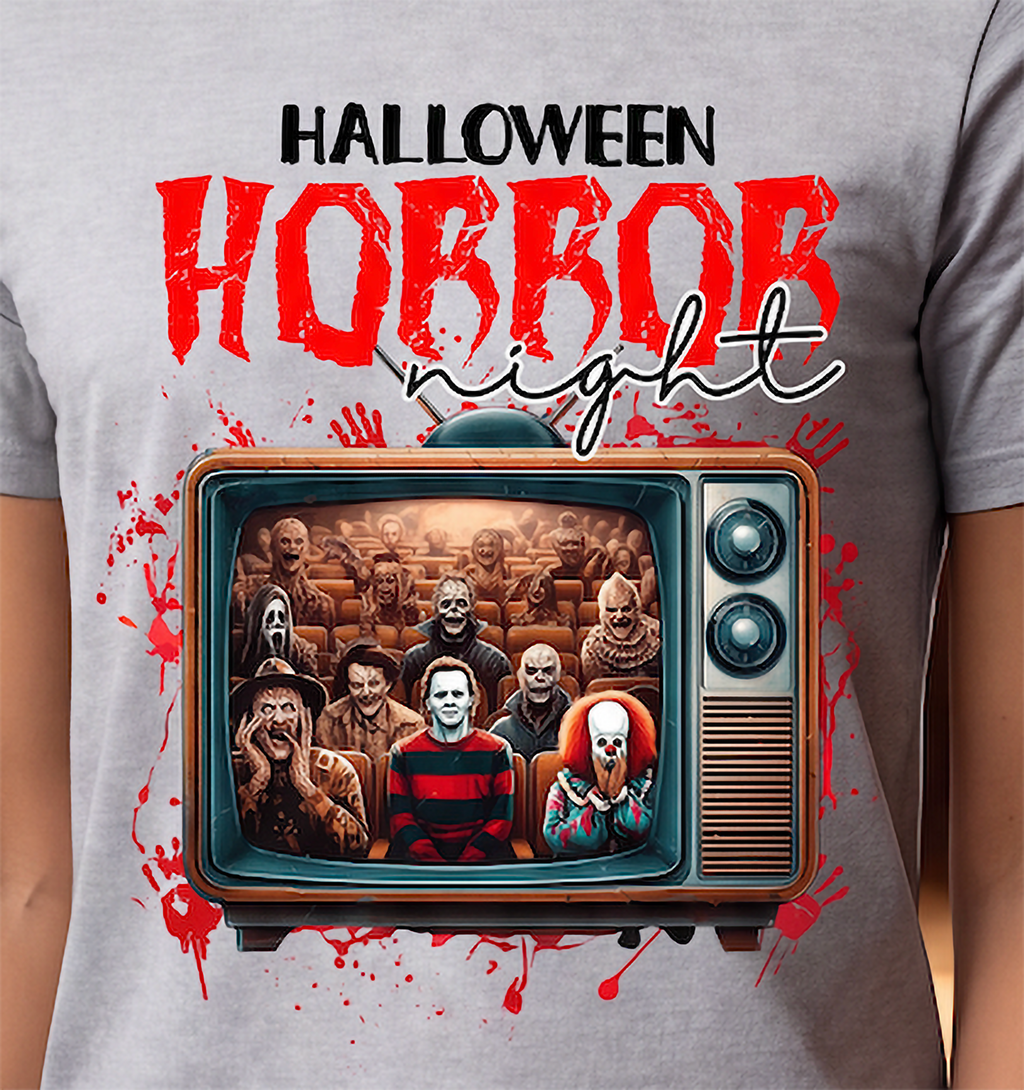 Close-up of horror movie Halloween graphic on Heather Gray shirt featuring retro TV, scary figures and red splatter