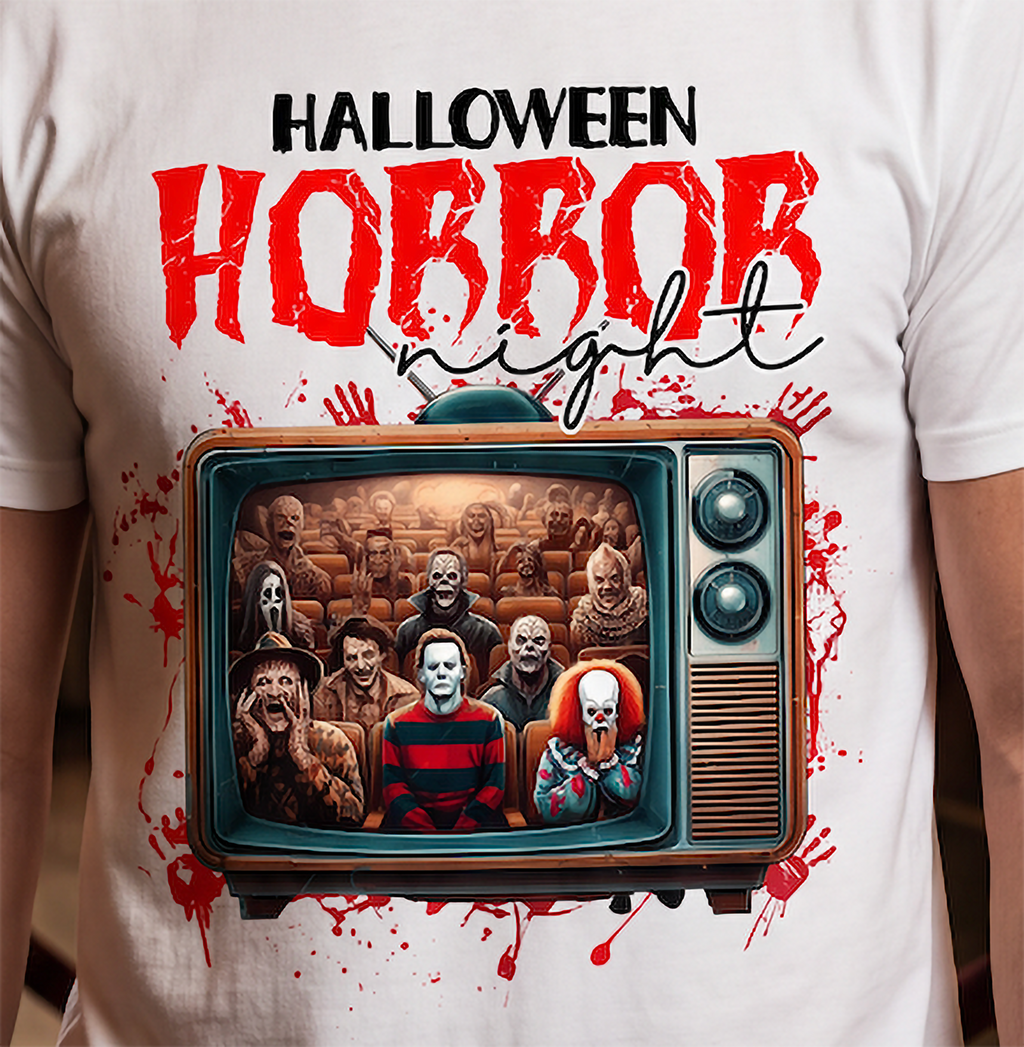 Close-up of retro TV horror movie graphic with slasher-inspired figures and distressed red Halloween artwork on white shirt