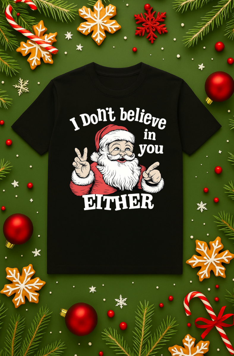 Black Christmas t-shirt with a funny Santa graphic and the text ‘I Don’t Believe in You Either’ on a green holiday background with ornaments and candy canes.