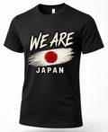 A black short-sleeve crewneck t-shirt featuring a distressed graphic print of the Japanese flag and the text 'WE ARE JAPAN' in white and red.