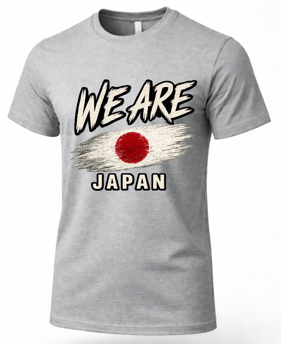 A heather gray short-sleeve t-shirt with a graphic print on the front. The design features the text 'WE ARE' in a stylized black-and-white font above a distressed Japanese flag design, and 'JAPAN' in white block letters below.
