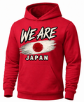 A red pullover hoodie with a front graphic that reads 'WE ARE JAPAN' in white and black, featuring a stylized Japanese flag design across the chest.