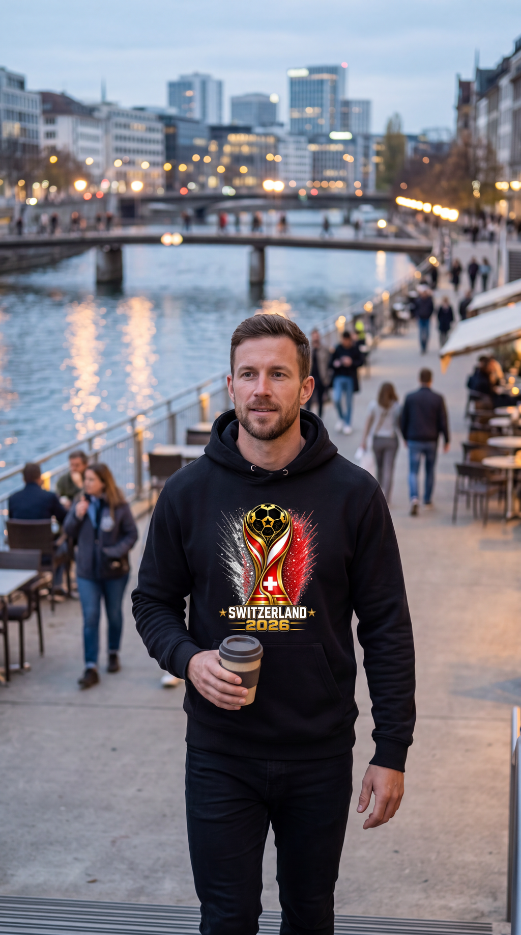 Man wearing a black hoodie with Algeria 2022 design on a city street.