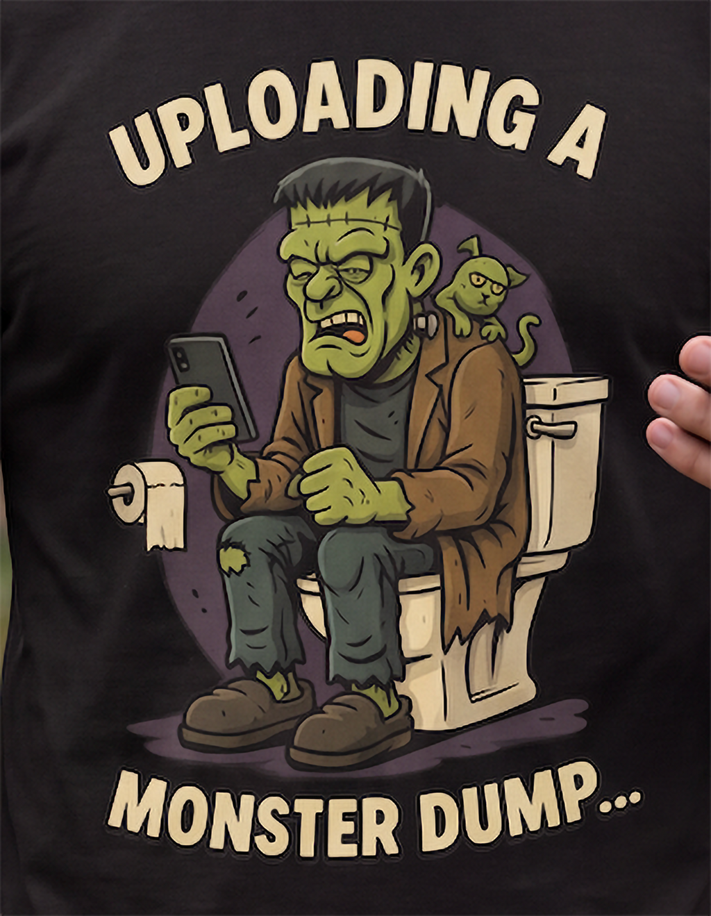 Close-up of Monster Dump Halloween graphic featuring green monster, toilet, phone and cat