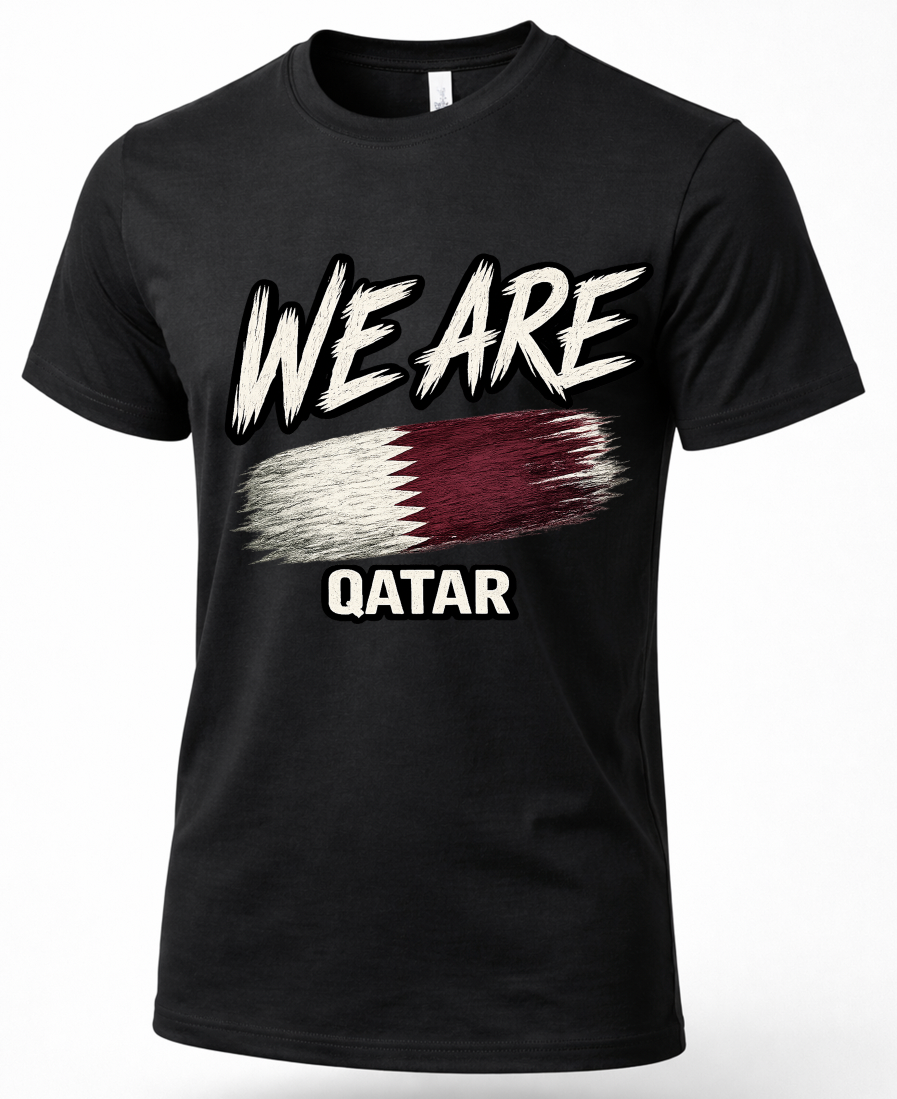 A black short-sleeve crewneck t-shirt featuring a distressed graphic print of the word 'WE ARE' in white above a stylized Qatar flag, with 'QATAR' printed below in white.
