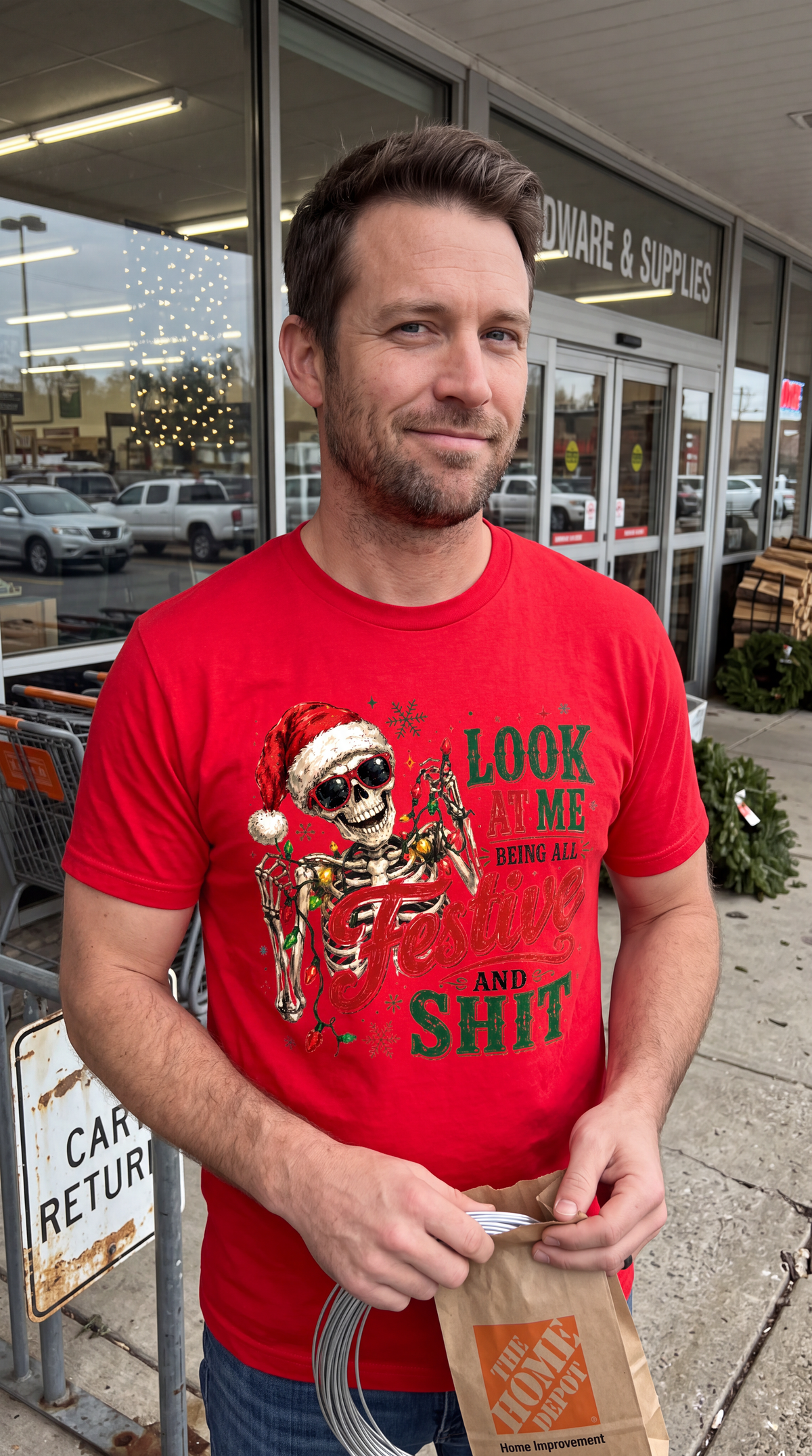 Red lifestyle: Man wearing red sarcastic Christmas shirt featuring skeleton in Santa hat wrapped in holiday lights.