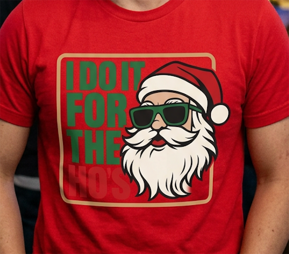 Close-up of naughty Santa Christmas saying graphic printed on a red holiday t-shirt.