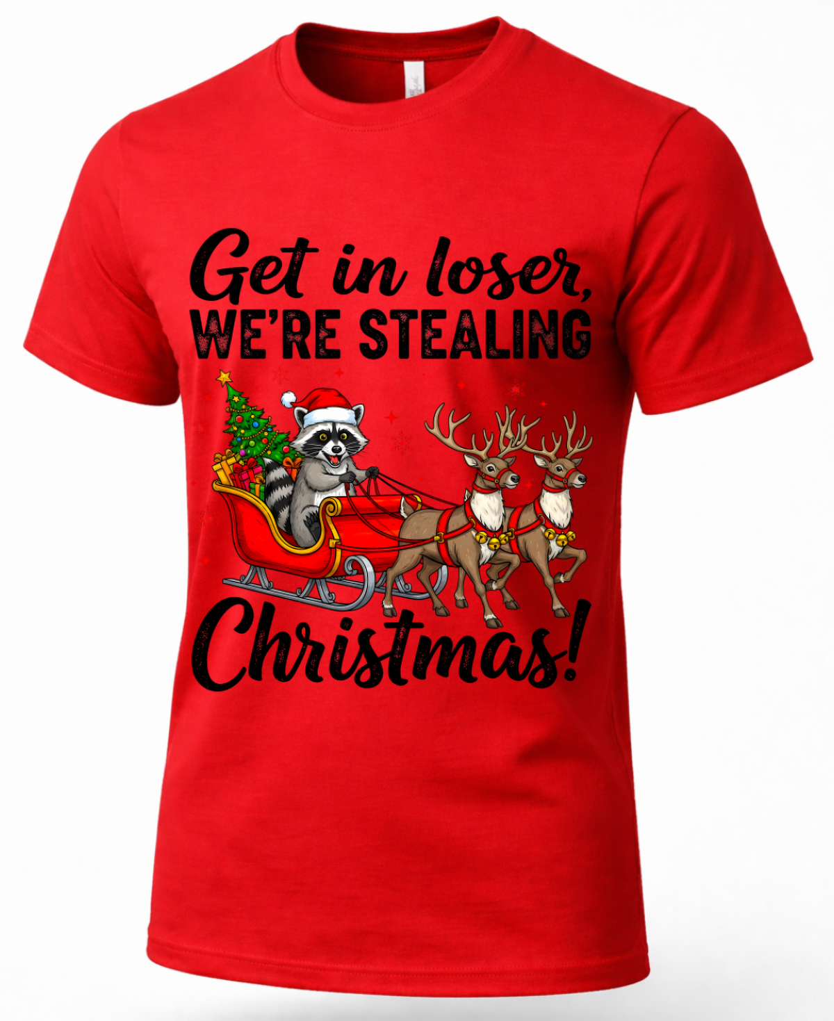 Red Christmas shirt featuring a mischievous raccoon in Santa’s sleigh with reindeer.