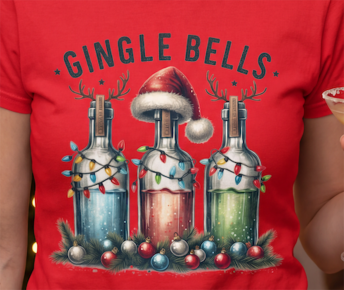 Close-up of Gingle Bells holiday liquor bottle Christmas design on red shirt