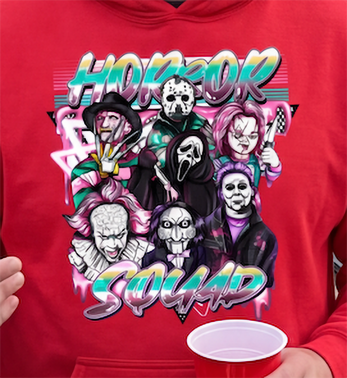 Close-up of red Horror Squad Halloween hoodie featuring classic horror characters