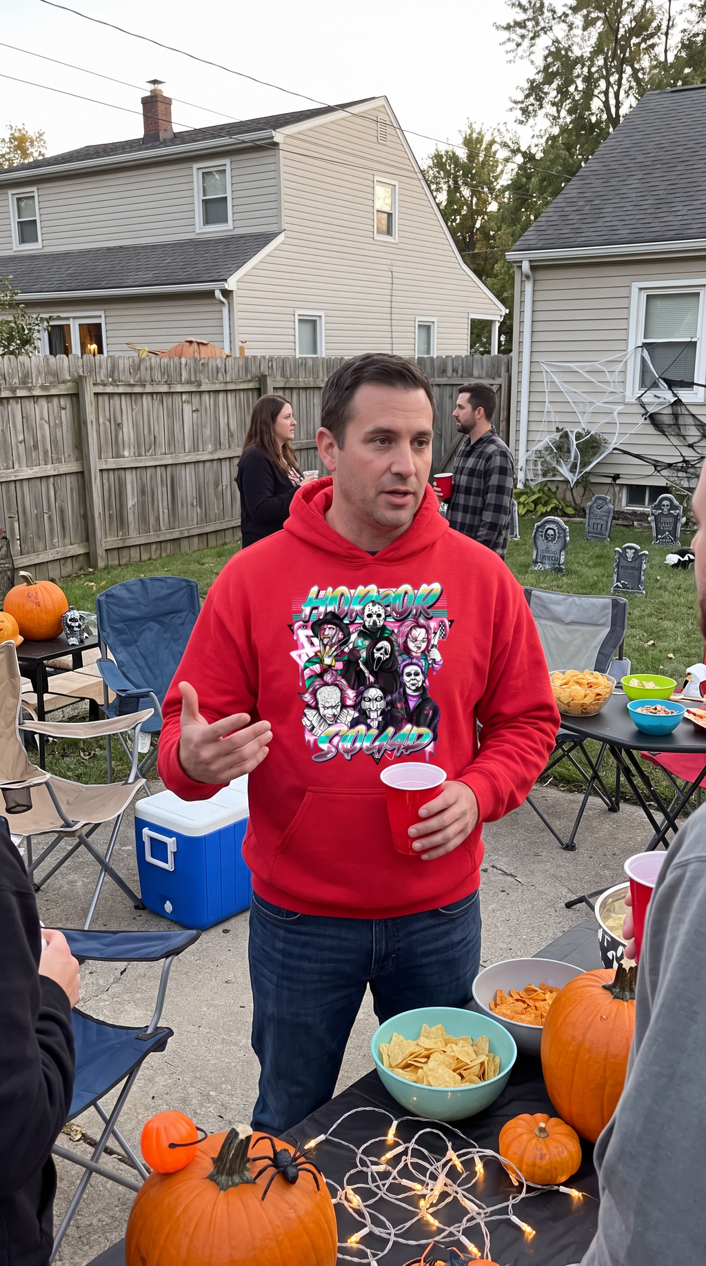 Woman wearing red Horror Squad hoodie for Halloween and spooky season