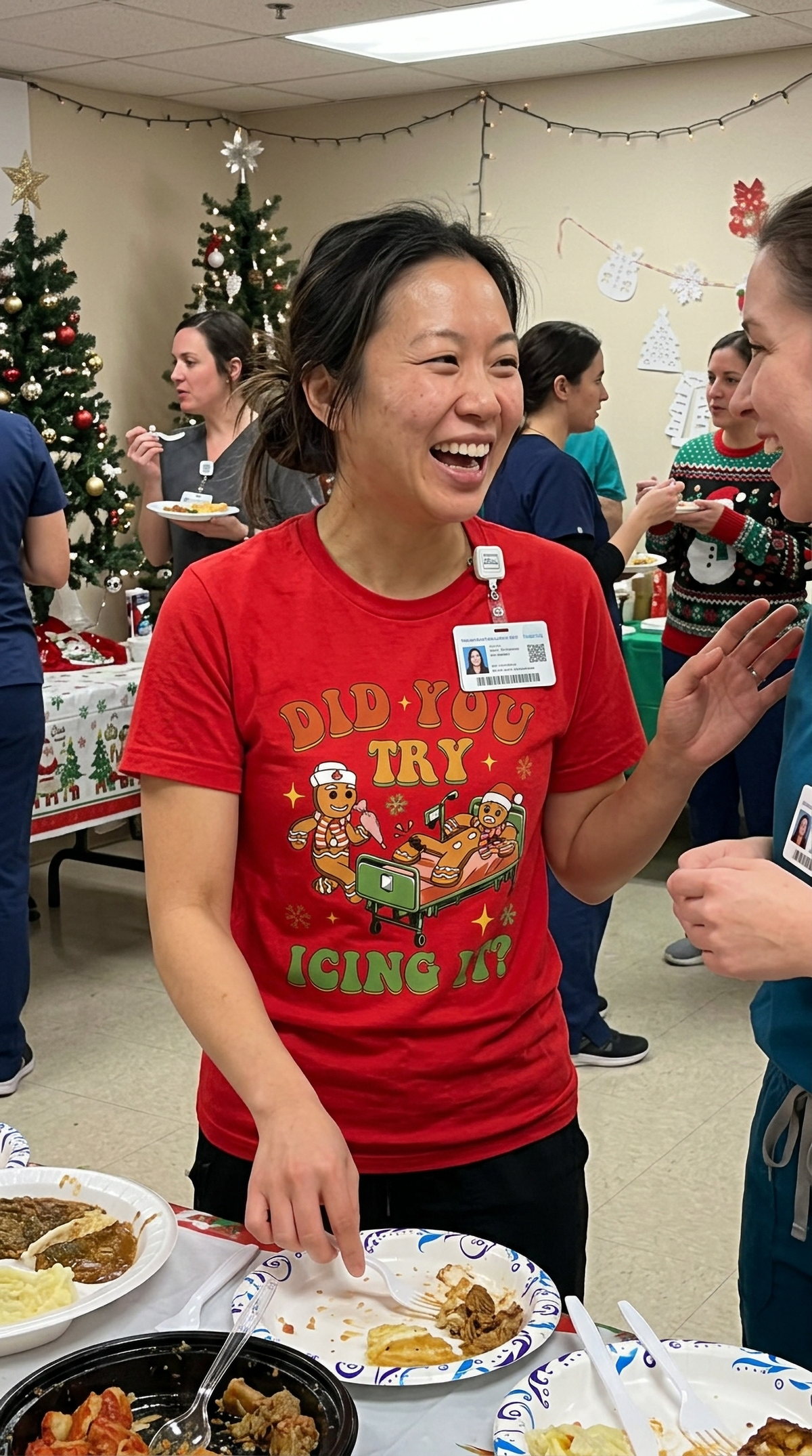 Smiling healthcare worker wearing a red funny gingerbread Christmas t-shirt with Did You Try Icing It design.