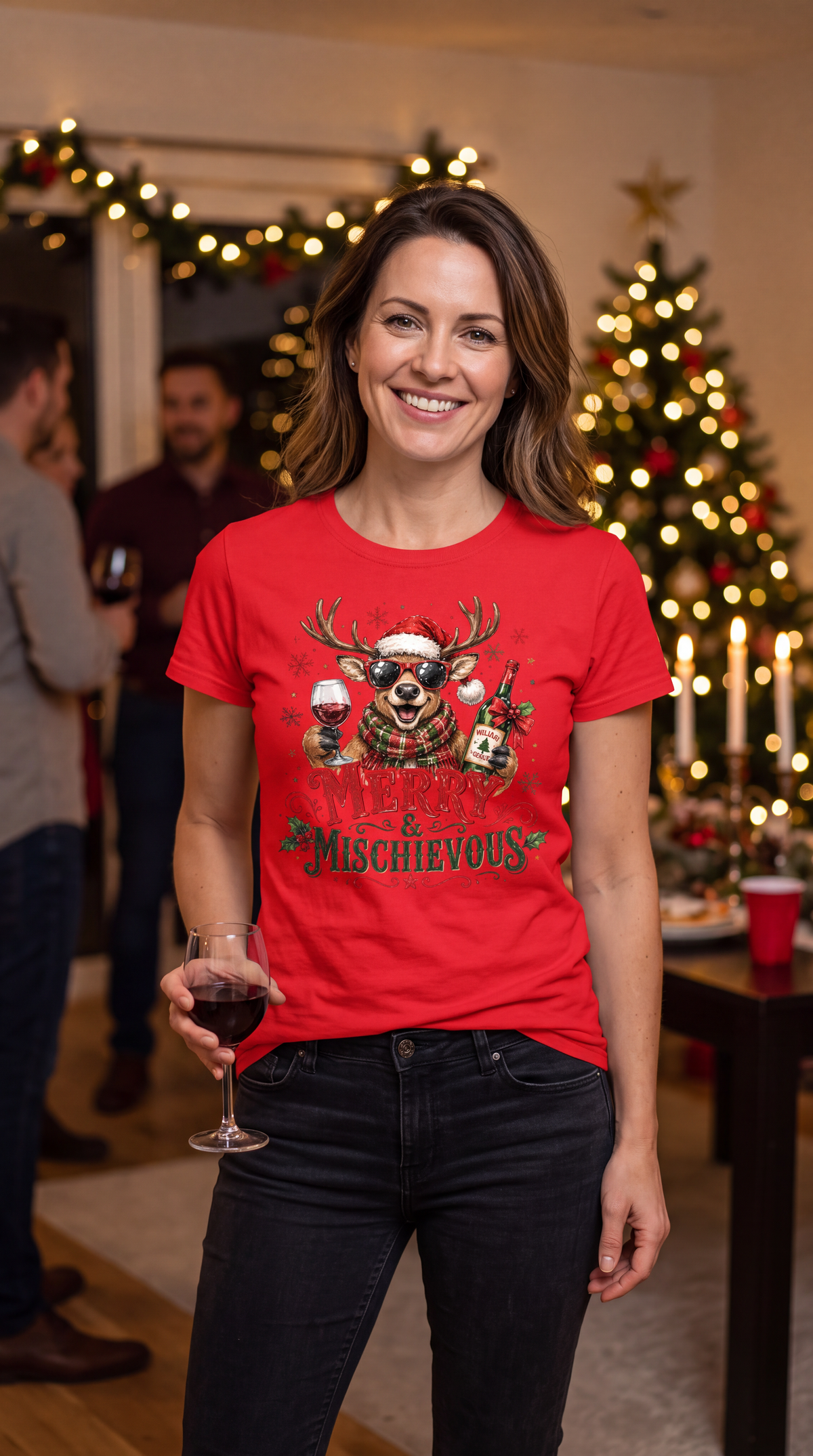Woman wearing red Merry & Mischievous Christmas shirt with festive reindeer graphic.