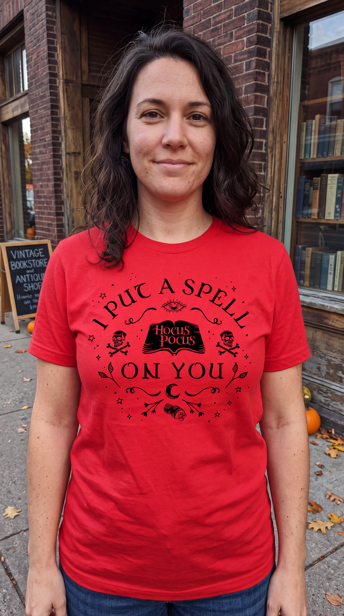 Woman wearing red Hocus Pocus I Put a Spell on You Halloween graphic tee