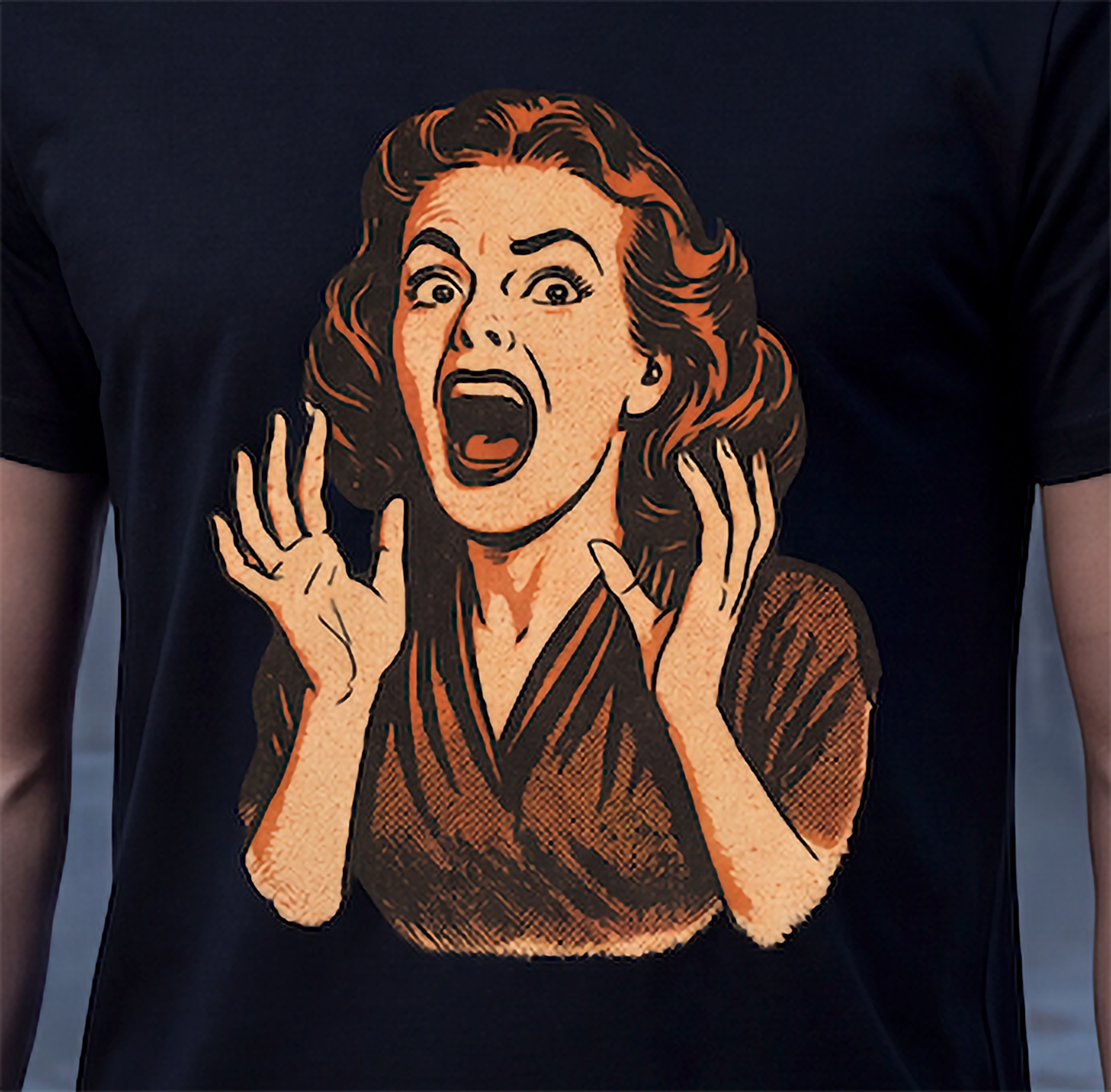 Close-up of vintage screaming woman graphic on black retro horror T-shirt
