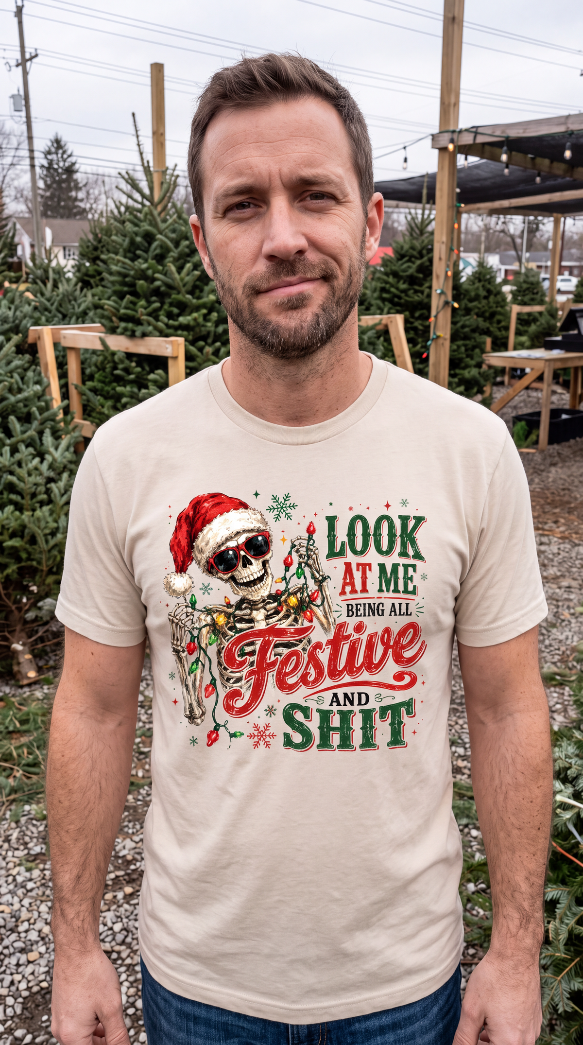 Sand lifestyle: Man wearing sand funny Christmas shirt featuring festive skeleton Santa graphic and sarcastic holiday saying.