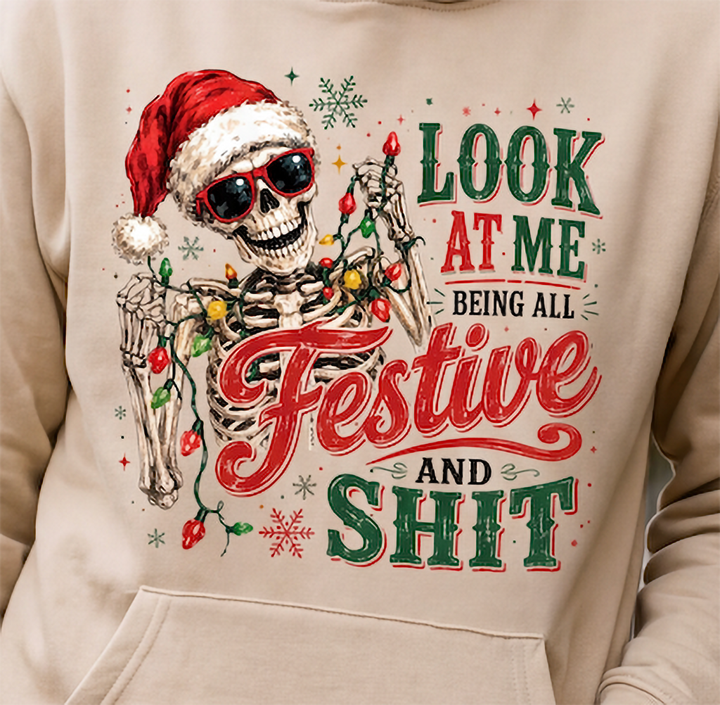 Close-up of sand skeleton Christmas hoodie with sarcastic festive graphic