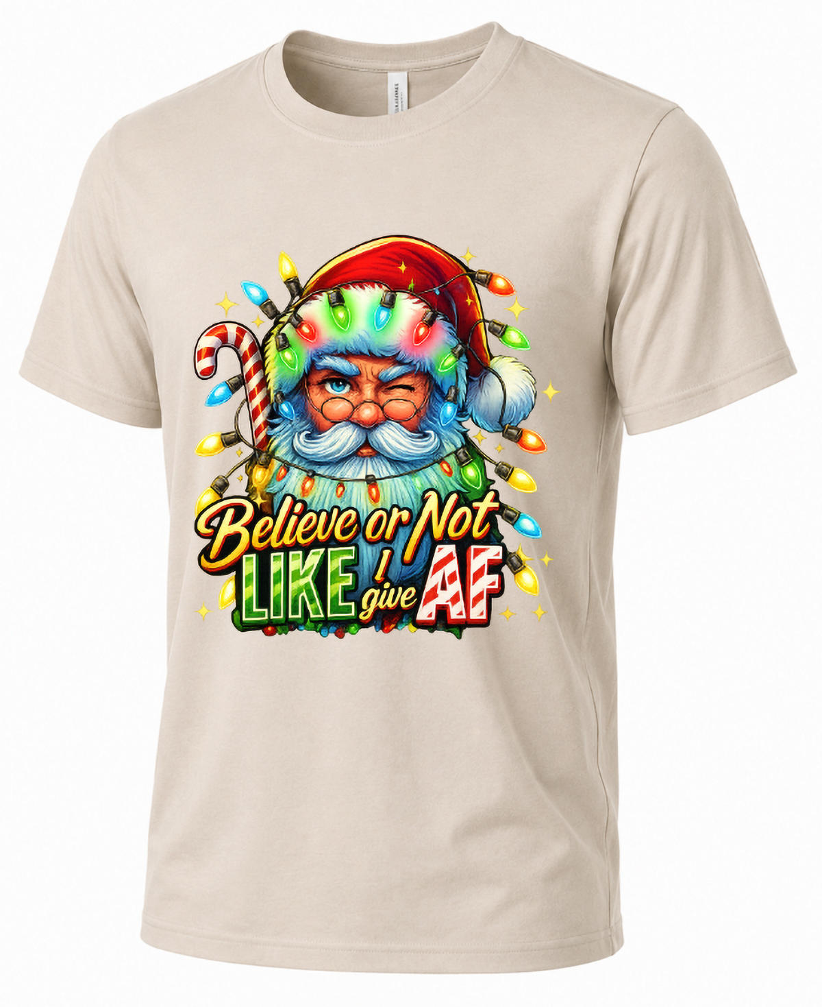Sand Mockup: Sand Bella Canvas Christmas graphic t-shirt featuring Santa Claus wrapped in colorful lights with sarcastic holiday humor.