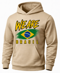 A beige pullover hoodie with a front graphic that reads 'WE ARE BRASIL' in yellow, featuring a stylized Brazilian flag design in green, yellow, blue, and white.