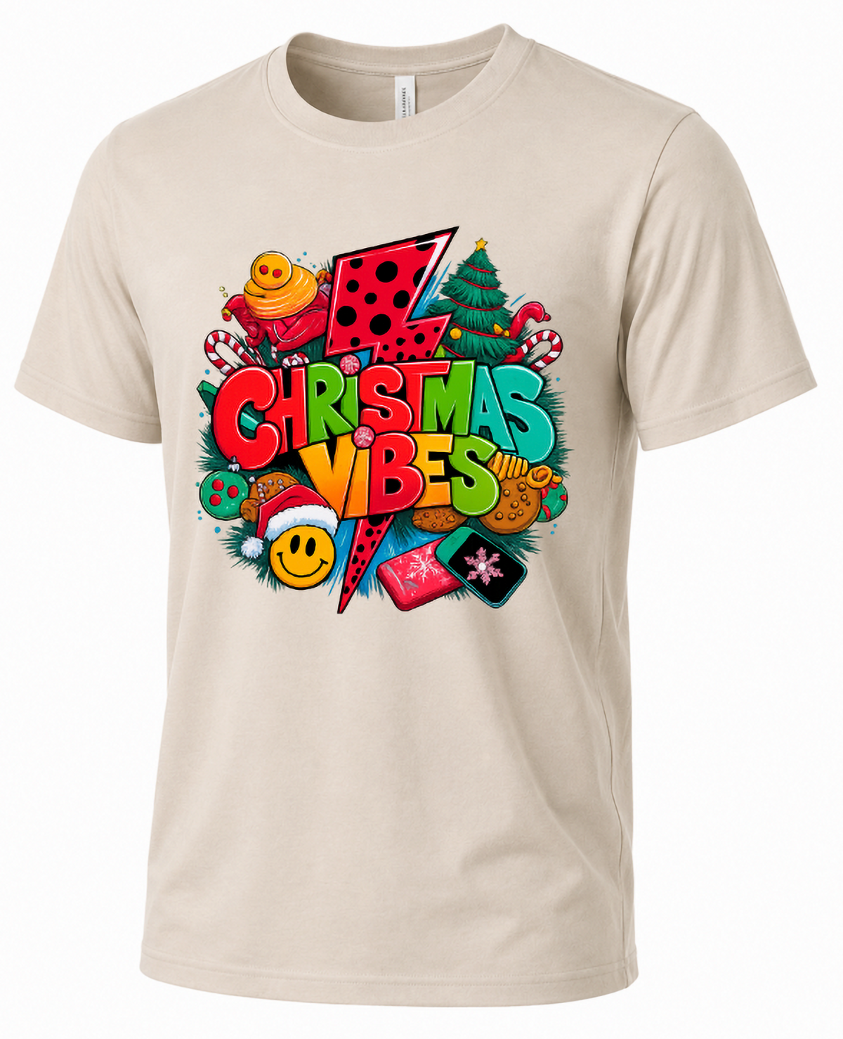 Sand Mockup: Sand-colored Christmas Vibes graphic t-shirt featuring bold retro holiday lettering, Christmas ornaments, and colorful festive illustrations.