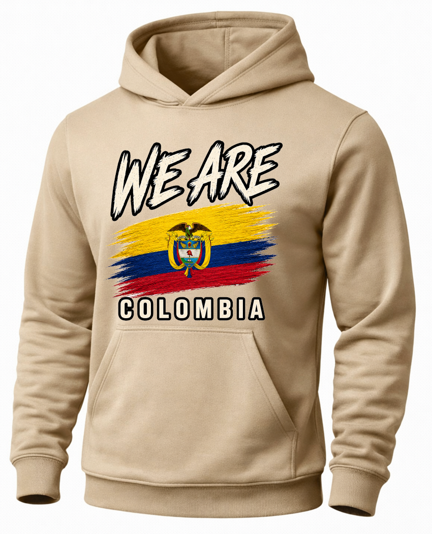 A beige pullover hoodie featuring a graphic print of the Colombian flag with the text 'WE ARE' above and 'COLOMBIA' below, shown on a plain white background.