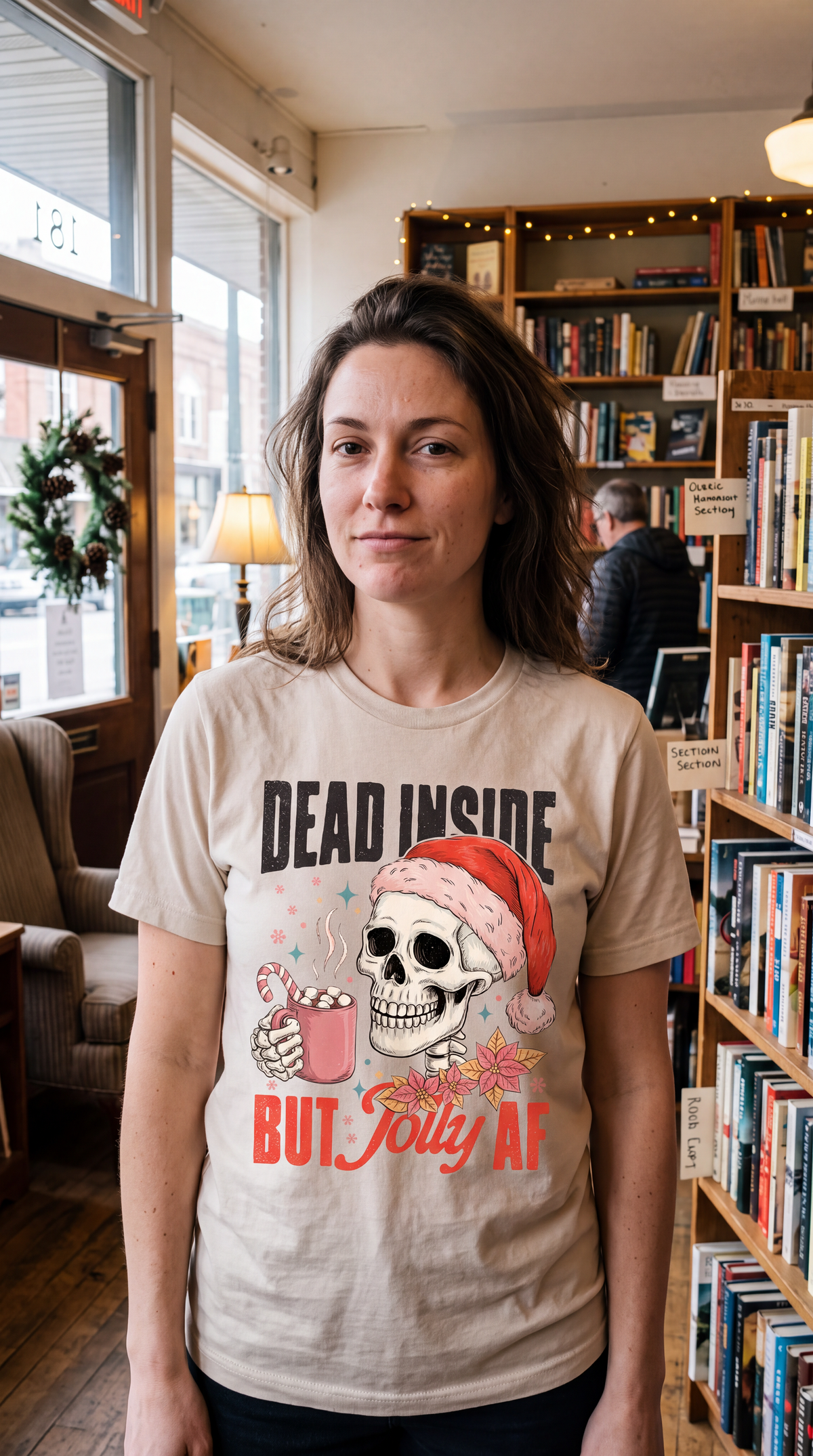Woman wearing sand Dead Inside But Jolly AF funny Christmas skeleton shirt.