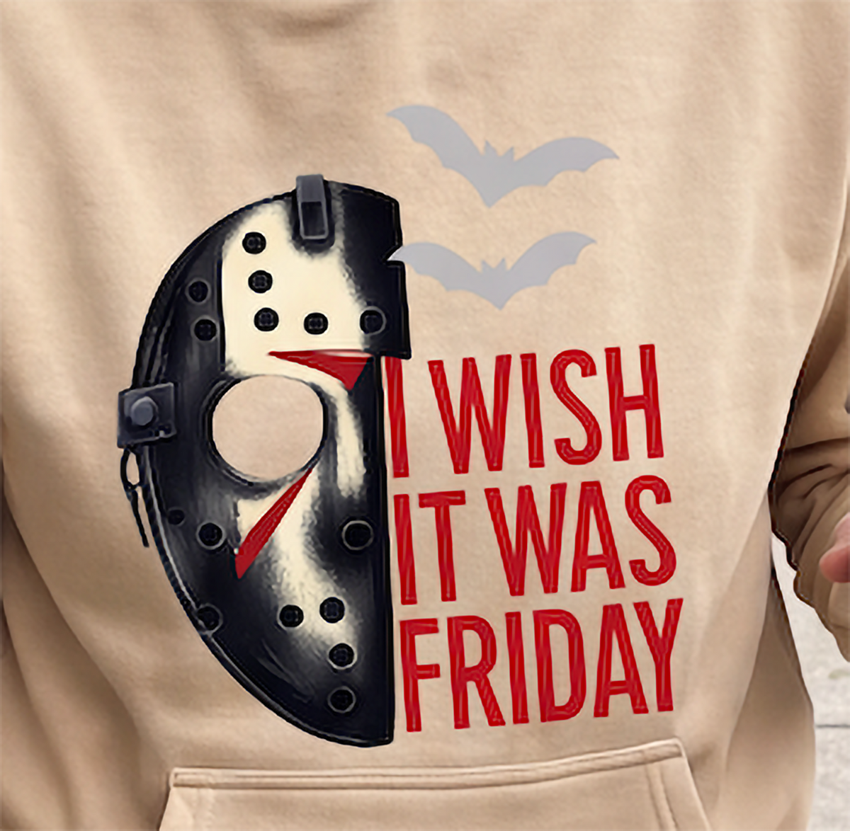 Close-up of sand Jason Voorhees horror hoodie with hockey mask graphic