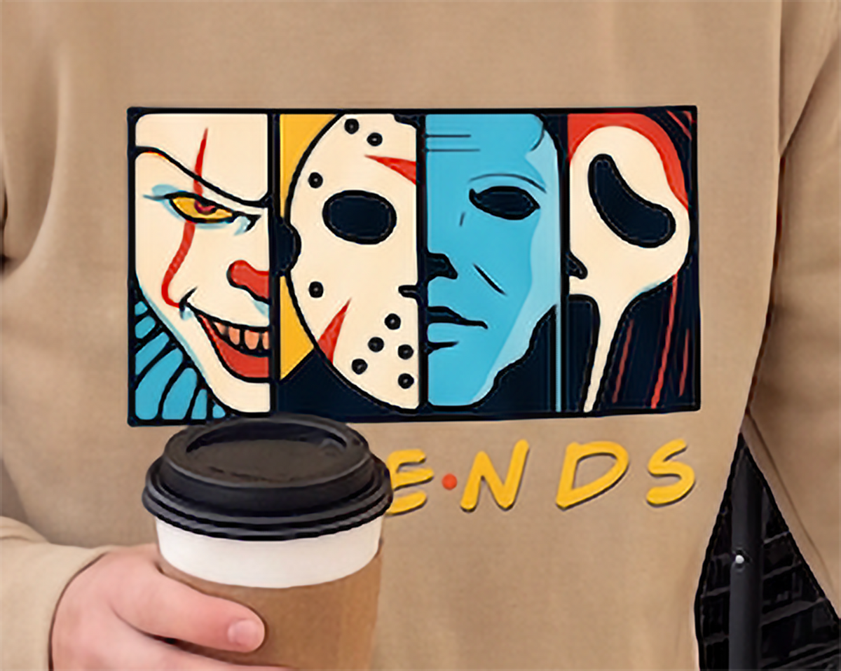 Close-up of colorful Horror Friends horror character graphic printed on sand hoodie.