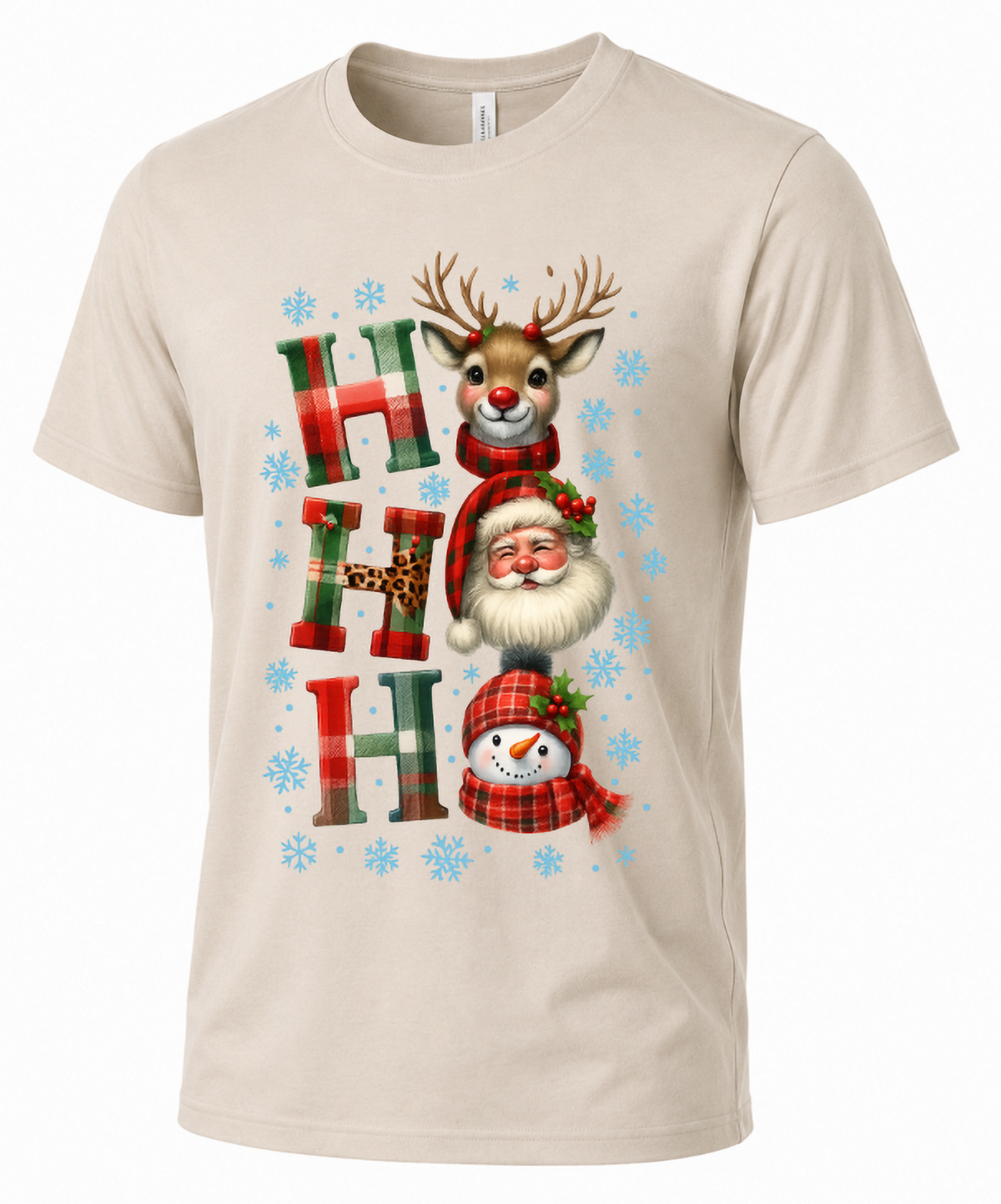 Sand-colored unisex Christmas graphic tee featuring festive Ho Ho Ho plaid lettering and holiday characters.