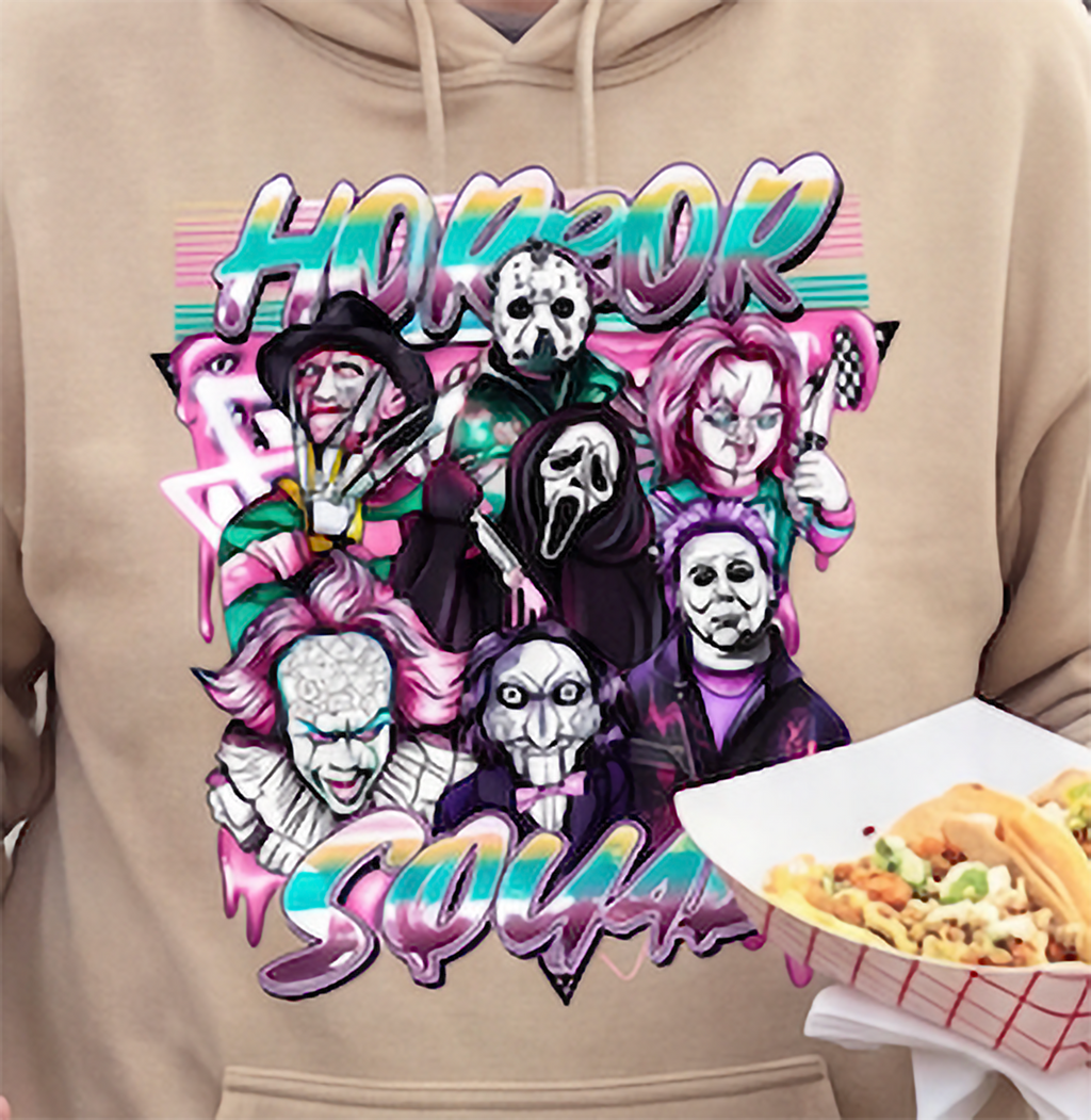 Close-up of sand Horror Squad Halloween hoodie featuring scary movie characters