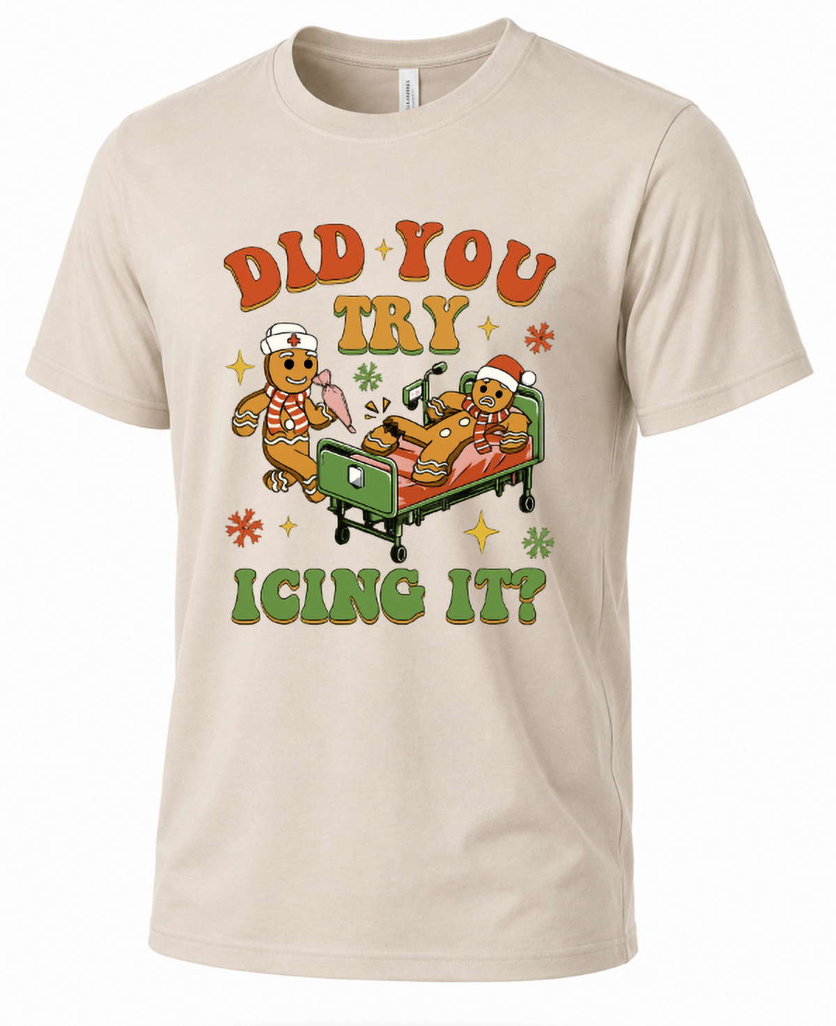 Sand-colored Christmas nurse graphic t-shirt with Did You Try Icing It gingerbread design.