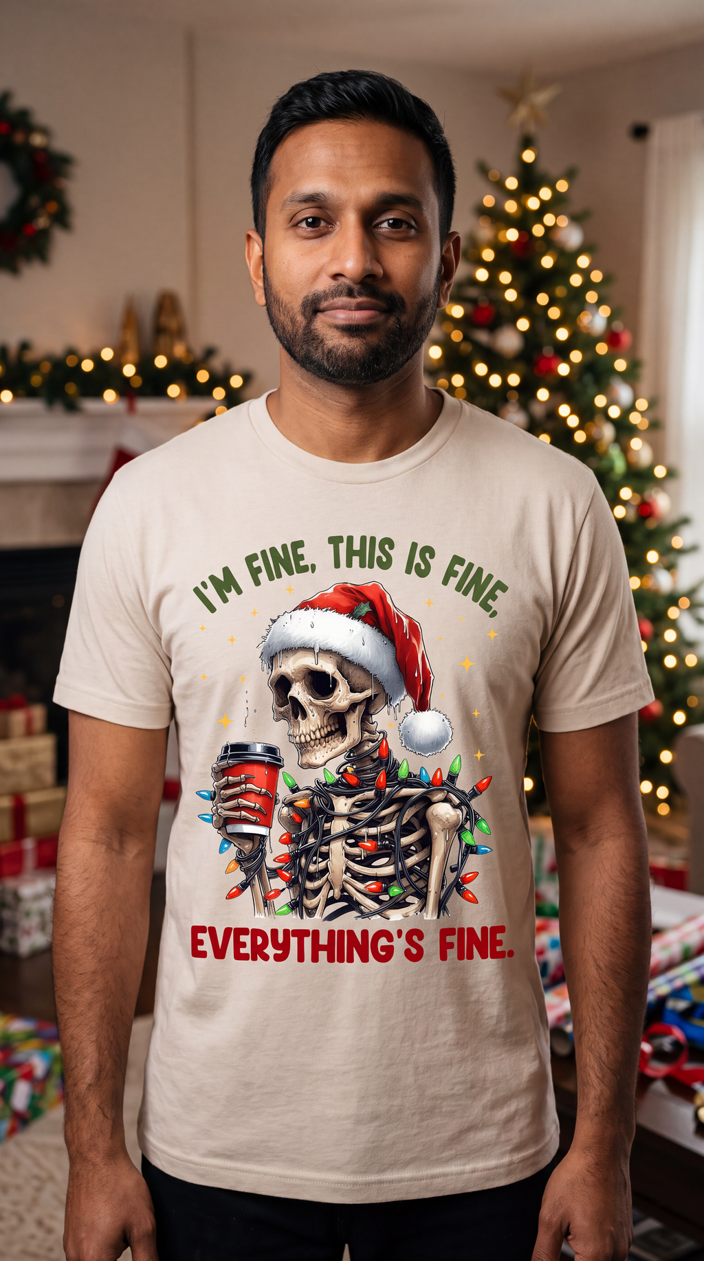 Man wearing sand I’m Fine Everything’s Fine Christmas shirt featuring a skeleton in a Santa hat with holiday lights.