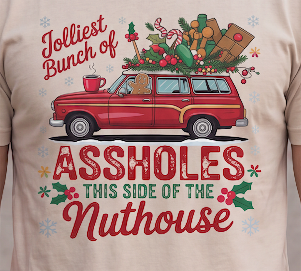 Close-up of Jolliest Bunch of Assholes Christmas graphic printed on sand shirt.