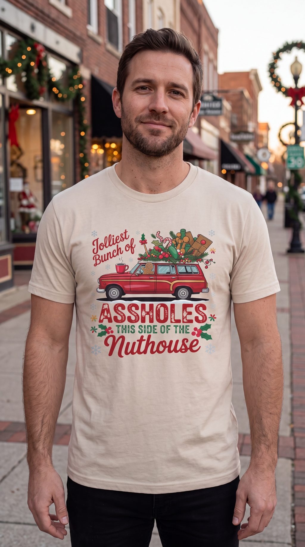 Man wearing red Jolliest Bunch of Assholes Christmas shirt in festive holiday setting
